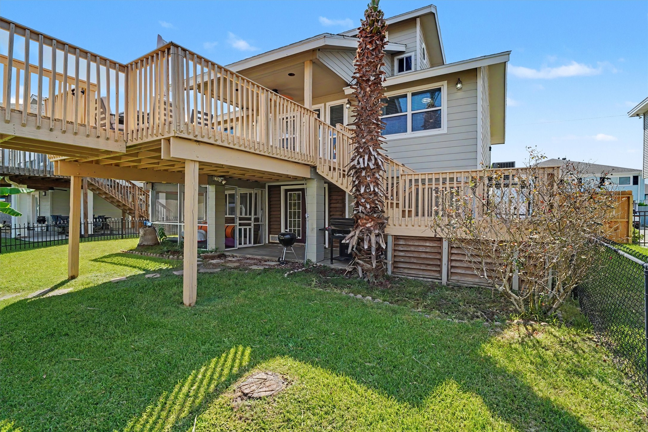 View of the home from the edge of the water side of the property