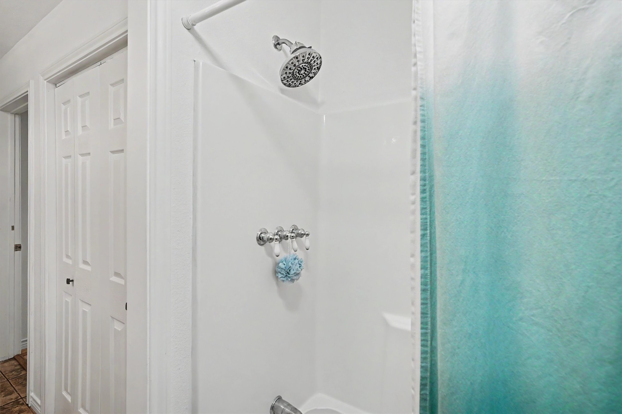 The closet is more storage and the guest bathroom hosts a shower/tub combo