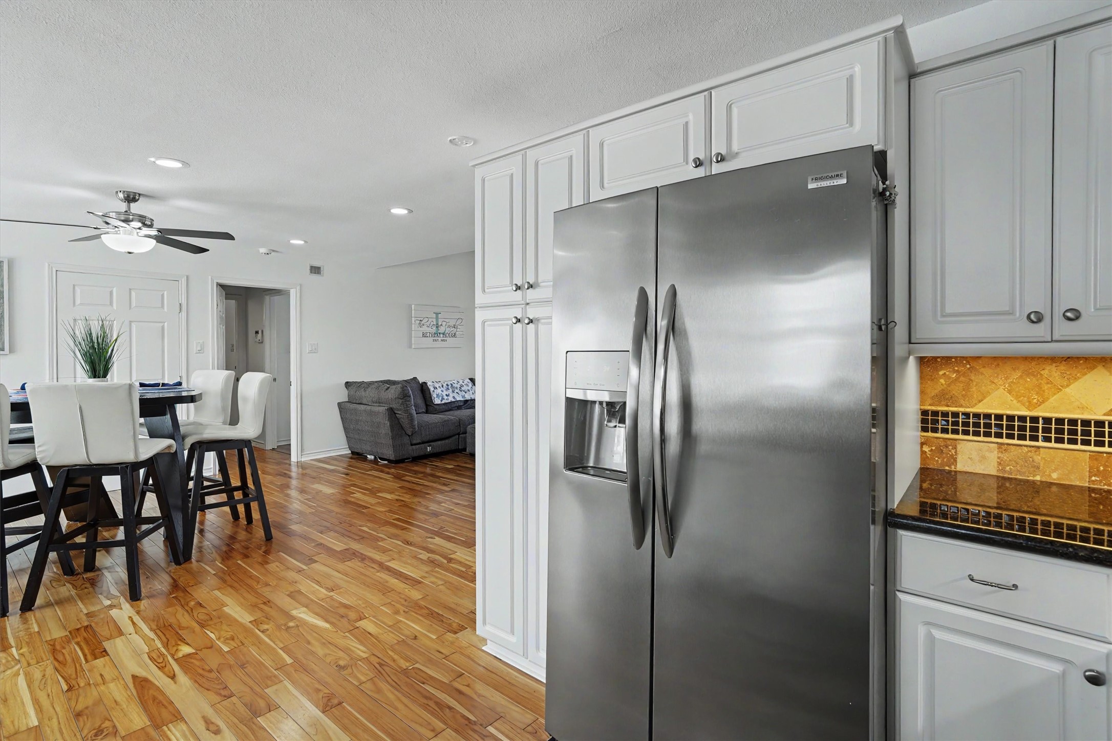 View from kitchen into the dining and living area. With the open concept entertaining in this home will be easy
