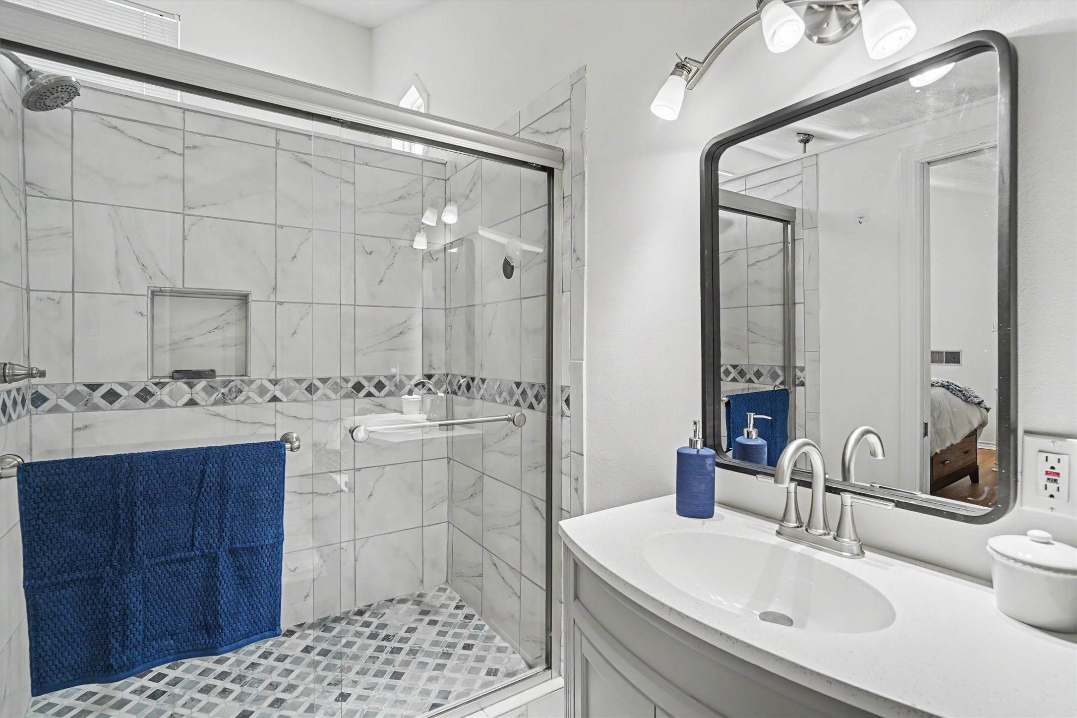 The primary ensuite was created and includes an oversized custom tiled walk in shower