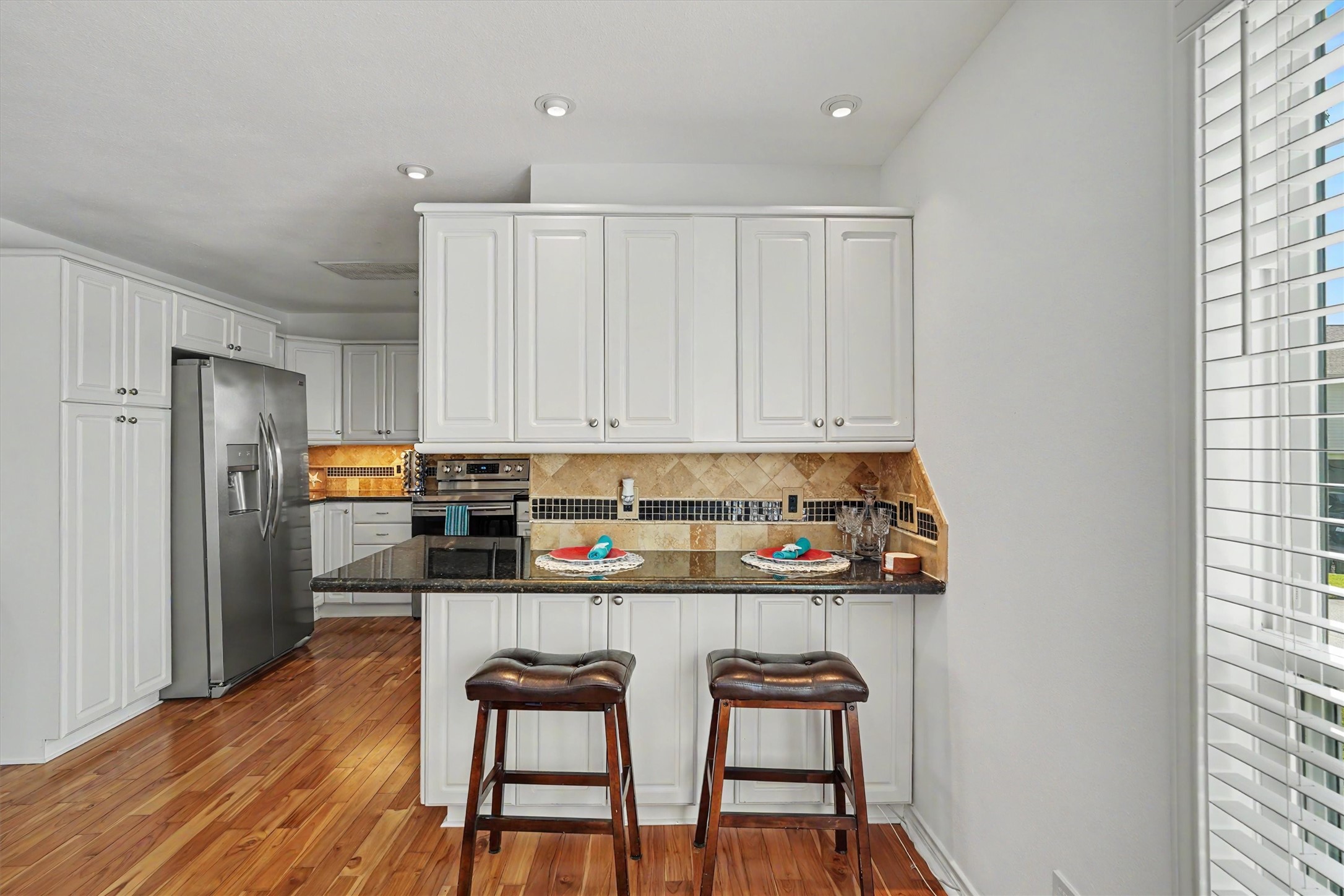 The kitchen has an abundance of cabinets with storage. The breakfast bar is perfect for those quick morning meals before you head out fishing