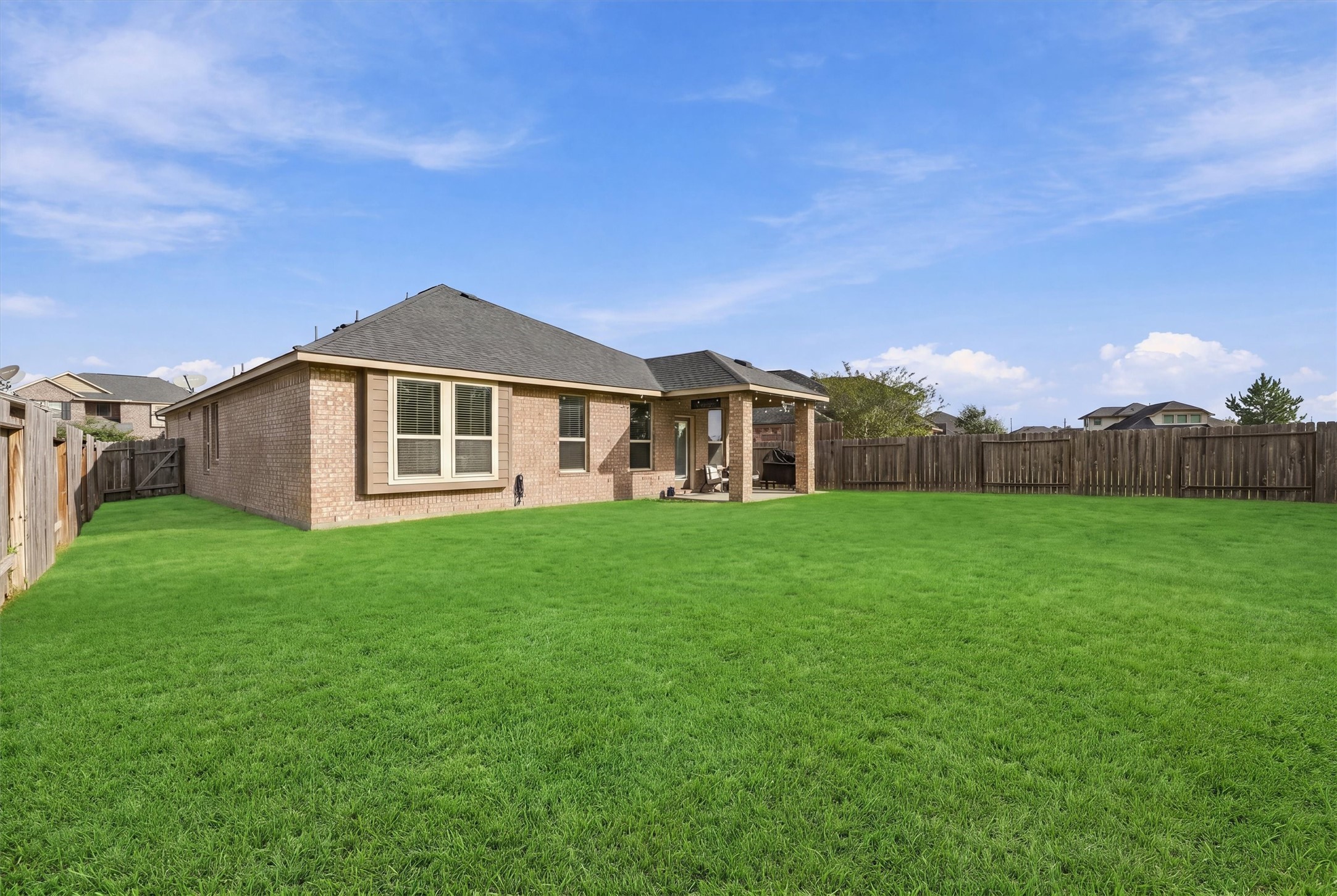 Spacious backyard with plenty of room for kids and pets to play in.