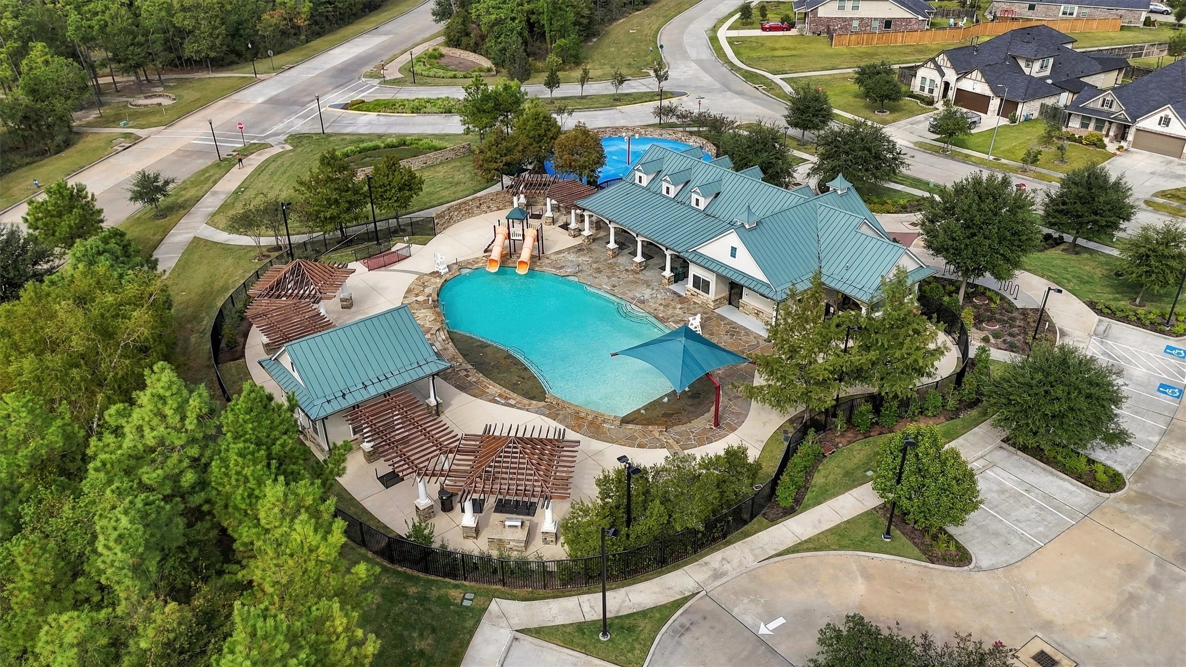 Located within walking distance, The Retreat recreation center featuring pool, splash pad, outdoor patio, covered pavilions and multiple grilling area.
