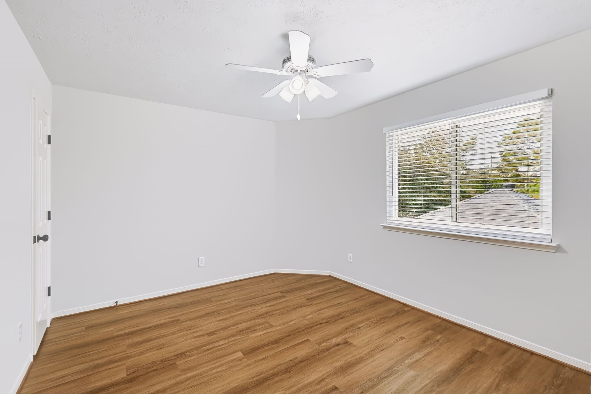 Need room for guests, hobbies or a second home office? This versatile upstairs bedroom offers a comfortable layout, ceiling fan, neutral finishes and a window that brings in natural light.