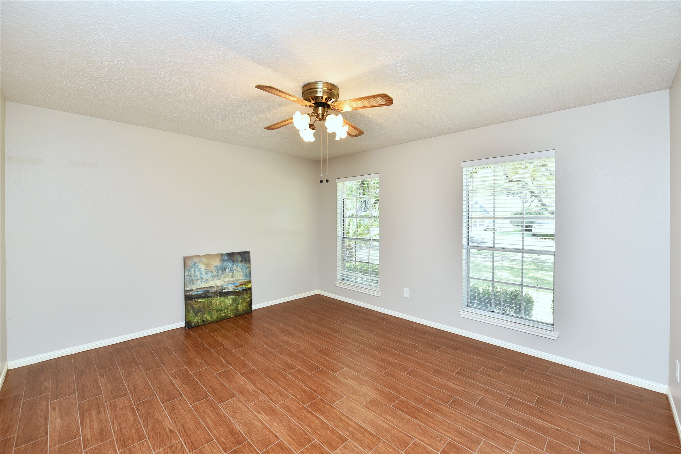 The formal living with wood tile would make a great study. The formal living with wood tile would make a great study.