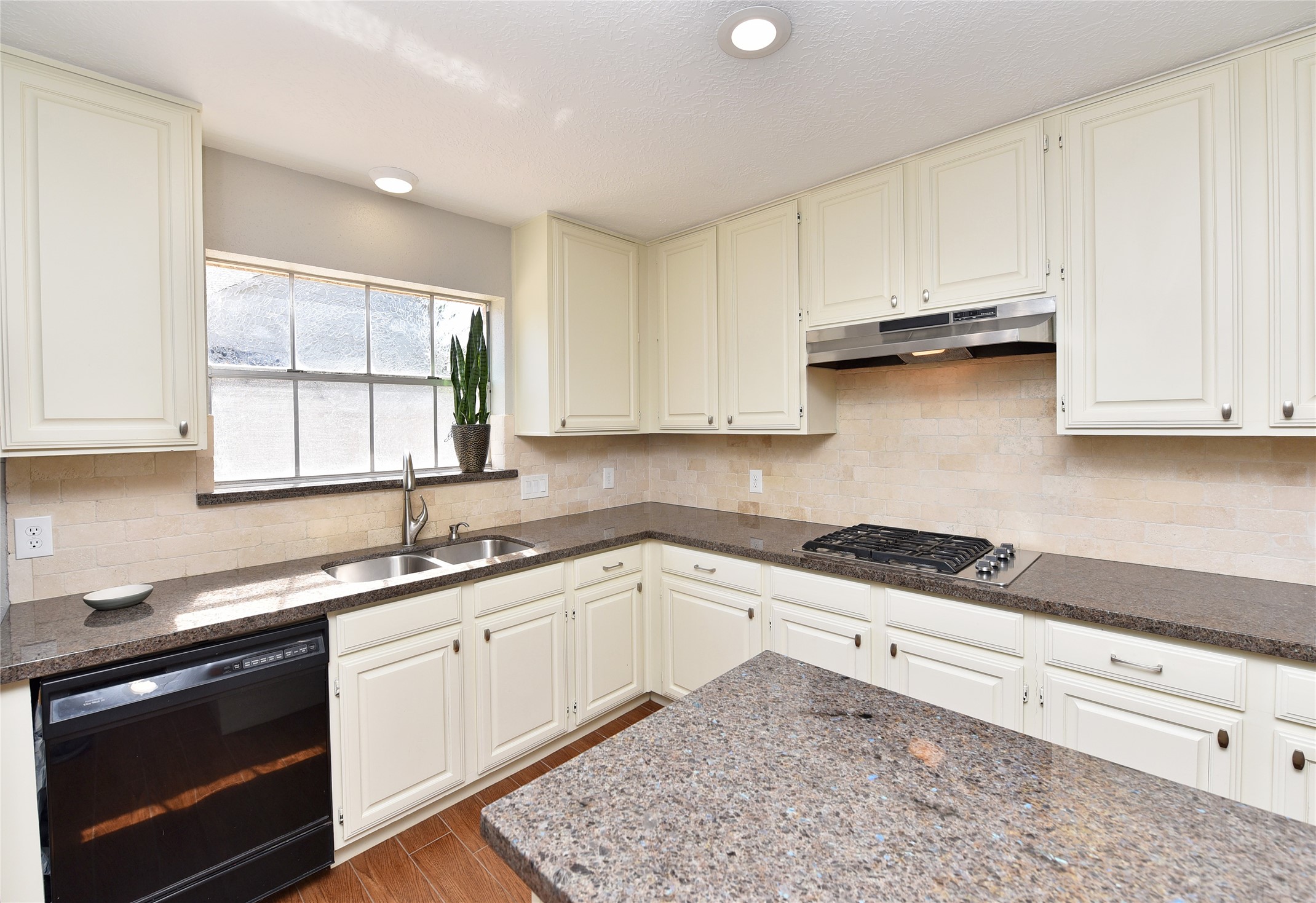 Tasteful updated kitchen with neutral colors throughout home.