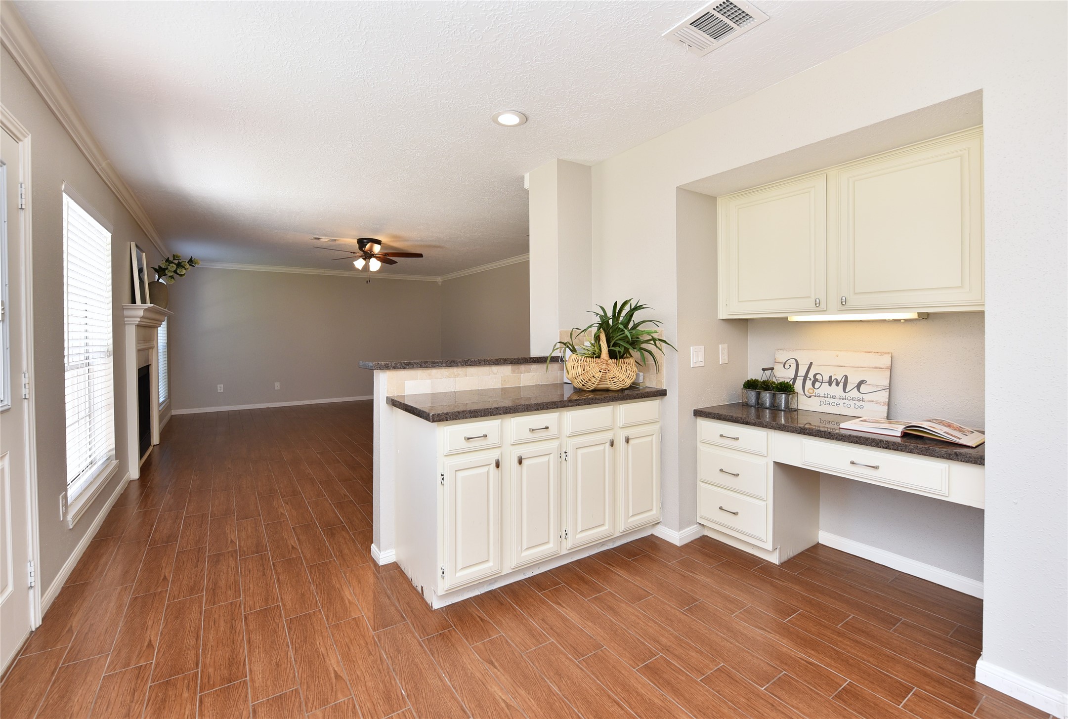 The kitchen has a nice desk and an entertaining area.