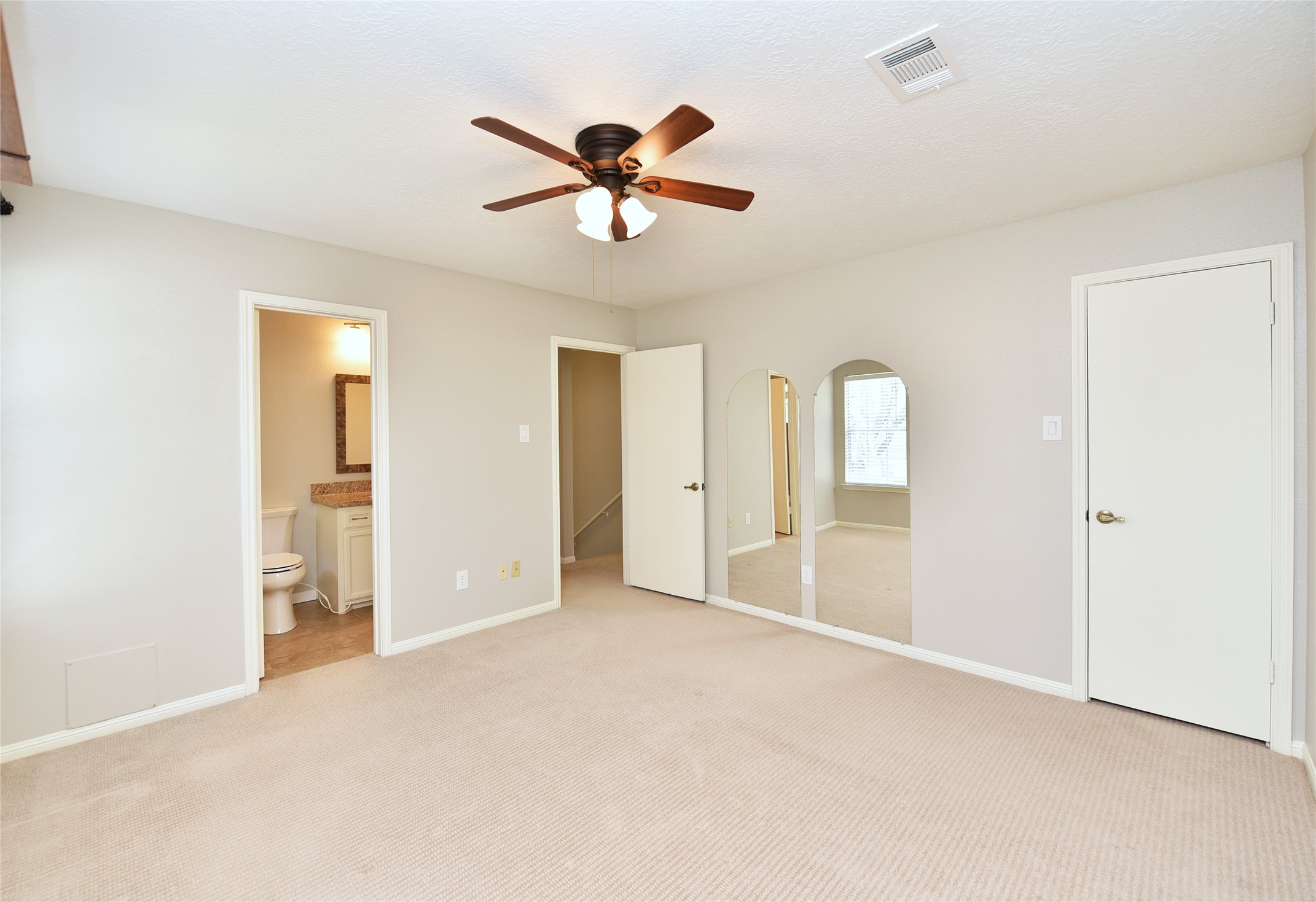 Spacious Bedroom 3 connects with a full bath