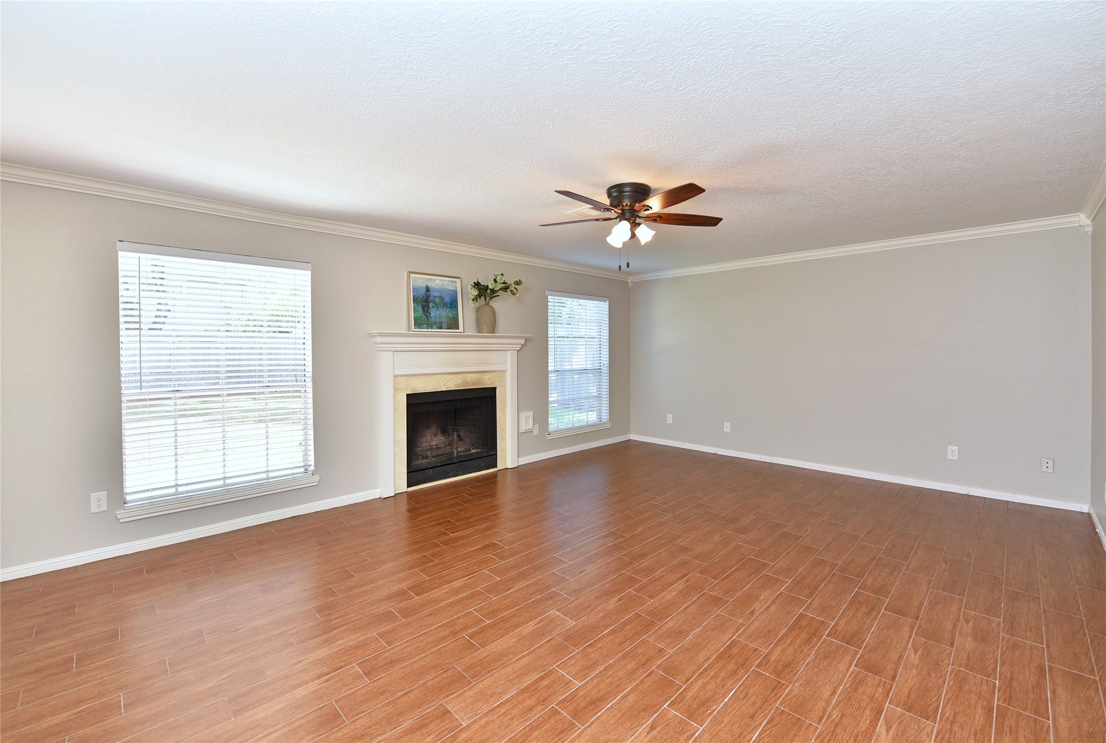 The large family room has a wood burning fireplace. The large family room has a wood burning fireplace.