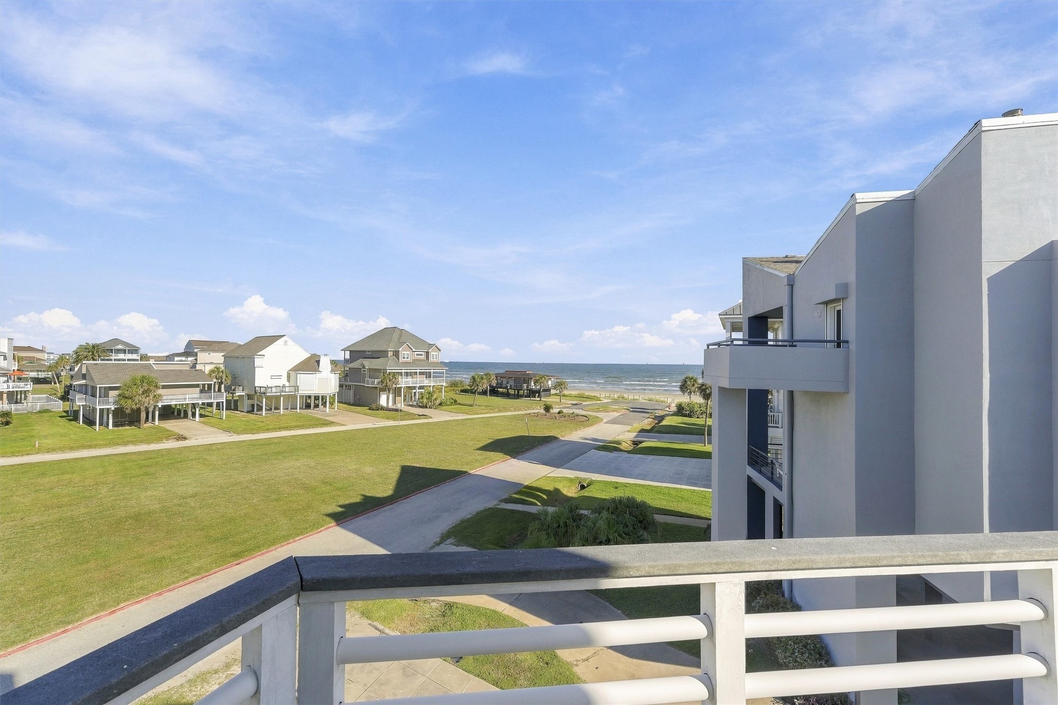 Pull up a chair, feel the sunshine, and watch the waves roll toward shore. This open-air balcony offers a peaceful perch for an afternoon read or a refreshing pause between trips to the beach.
