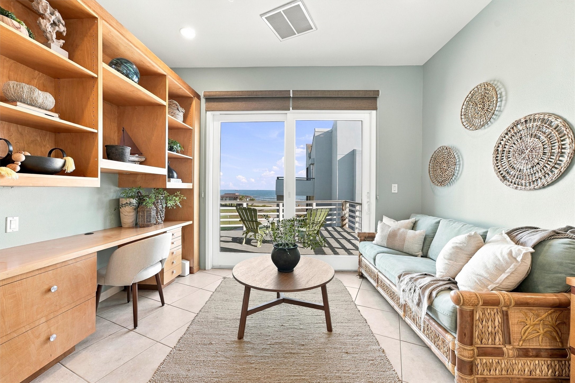 Finish a few emails, curl up with a favorite book, or step onto the balcony to watch the waves. With water views just beyond the glass, this inviting space makes even an ordinary afternoon feel like a getaway.