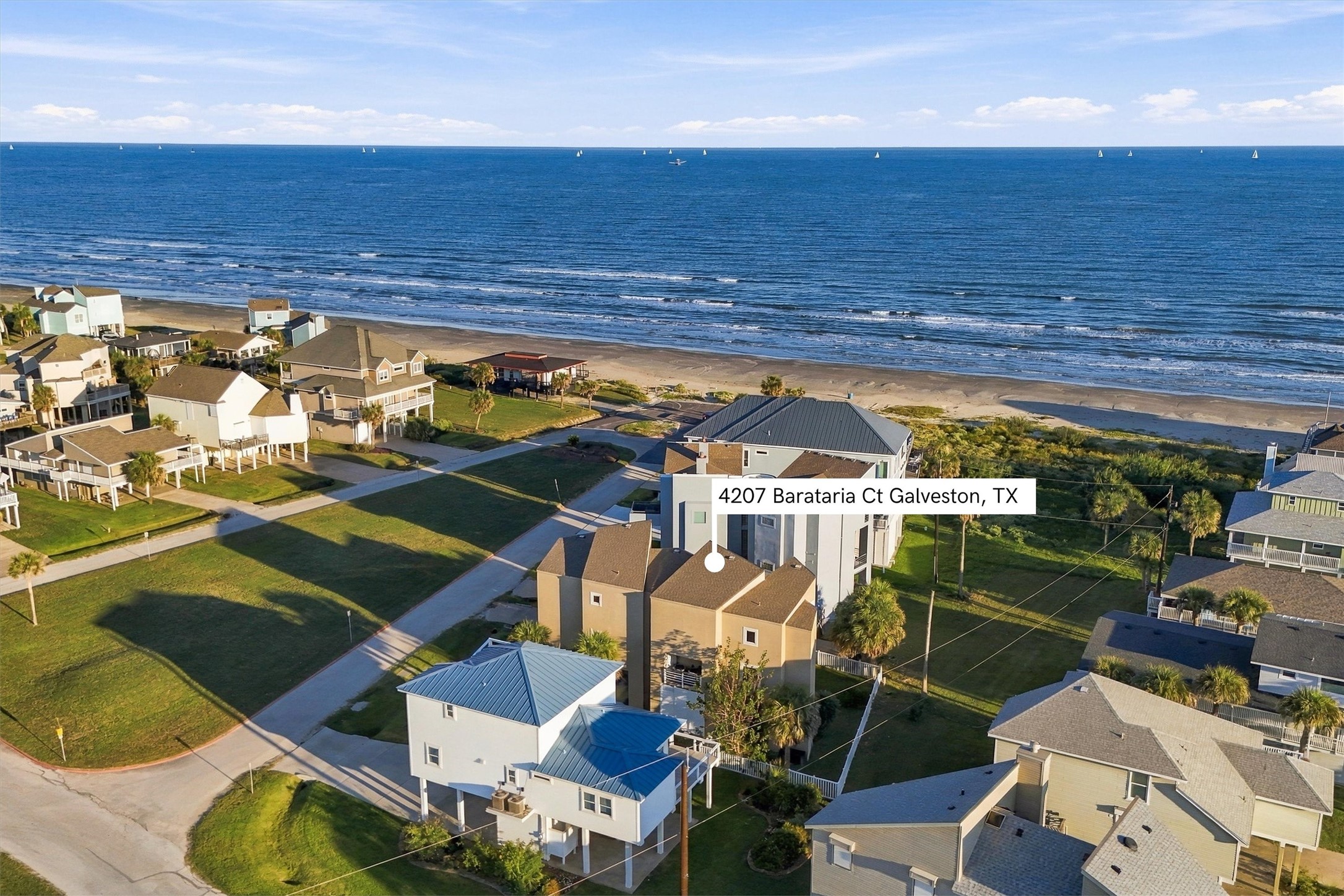 See just how close your next beach day could be. This aerial view highlights 4207 Barataria Courts setting just steps from the shoreline, where morning walks and spontaneous afternoons by the waves await.
