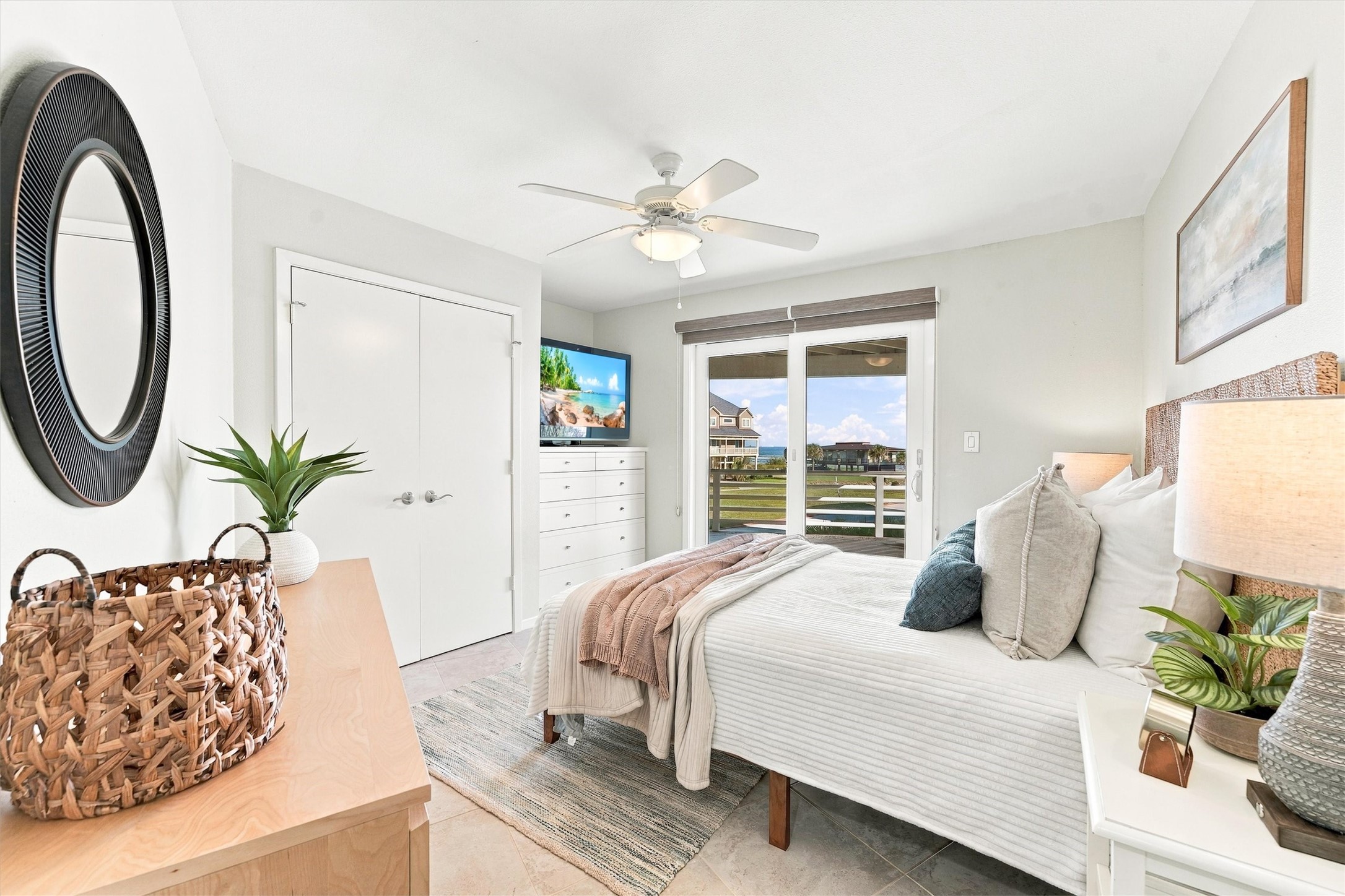 Wake to coastal scenery and sunlight streaming through sliding glass doors. With direct access to the covered balcony, this inviting bedroom puts morning coffee and a refreshing sea breeze just steps from your bed.