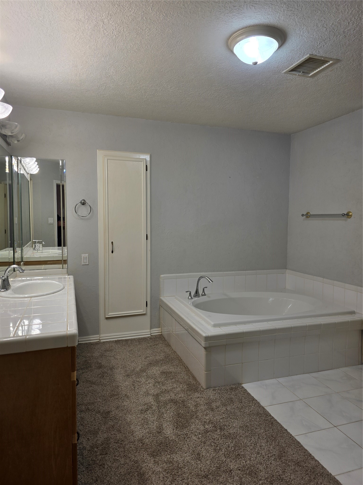 Primary Bathroom with tub and shower
