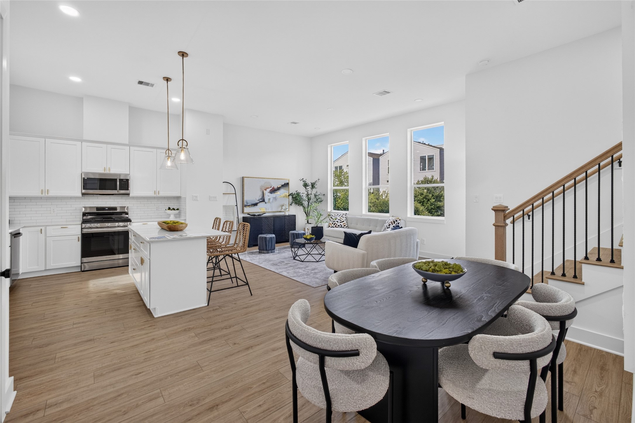 Dining area seamlessly connected to the living room, creating an ideal space for entertaining family and friends.