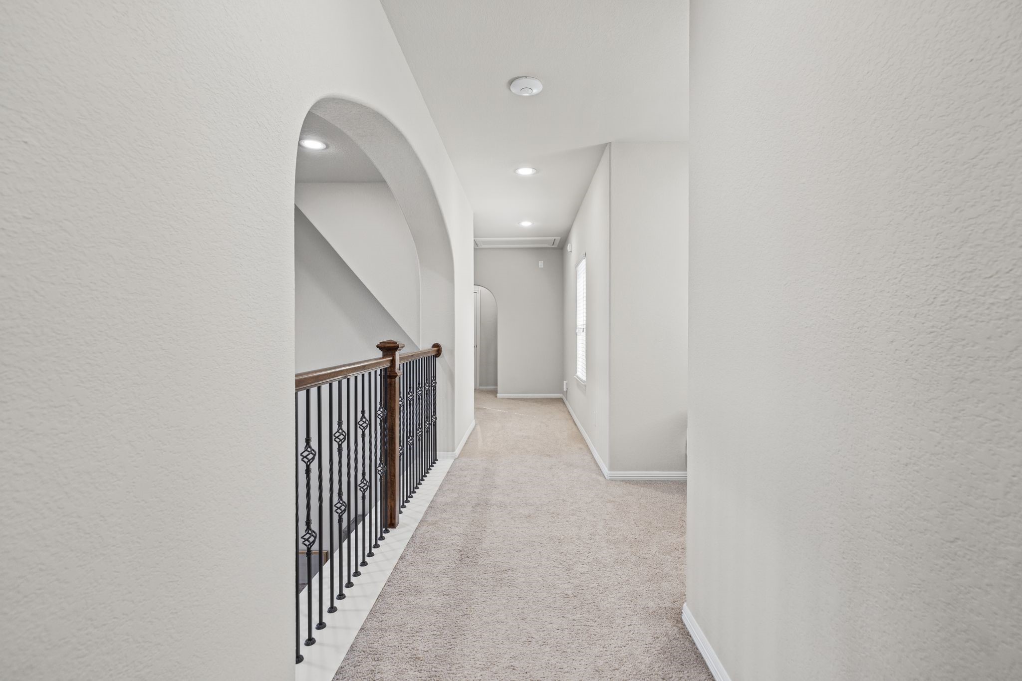 Thoughtfully designed second-floor layout features two secondary ensuite bedrooms on one side of the hallway, with a spacious gameroom/playroom, convenient half bath, and dedicated media room on the opposite side.