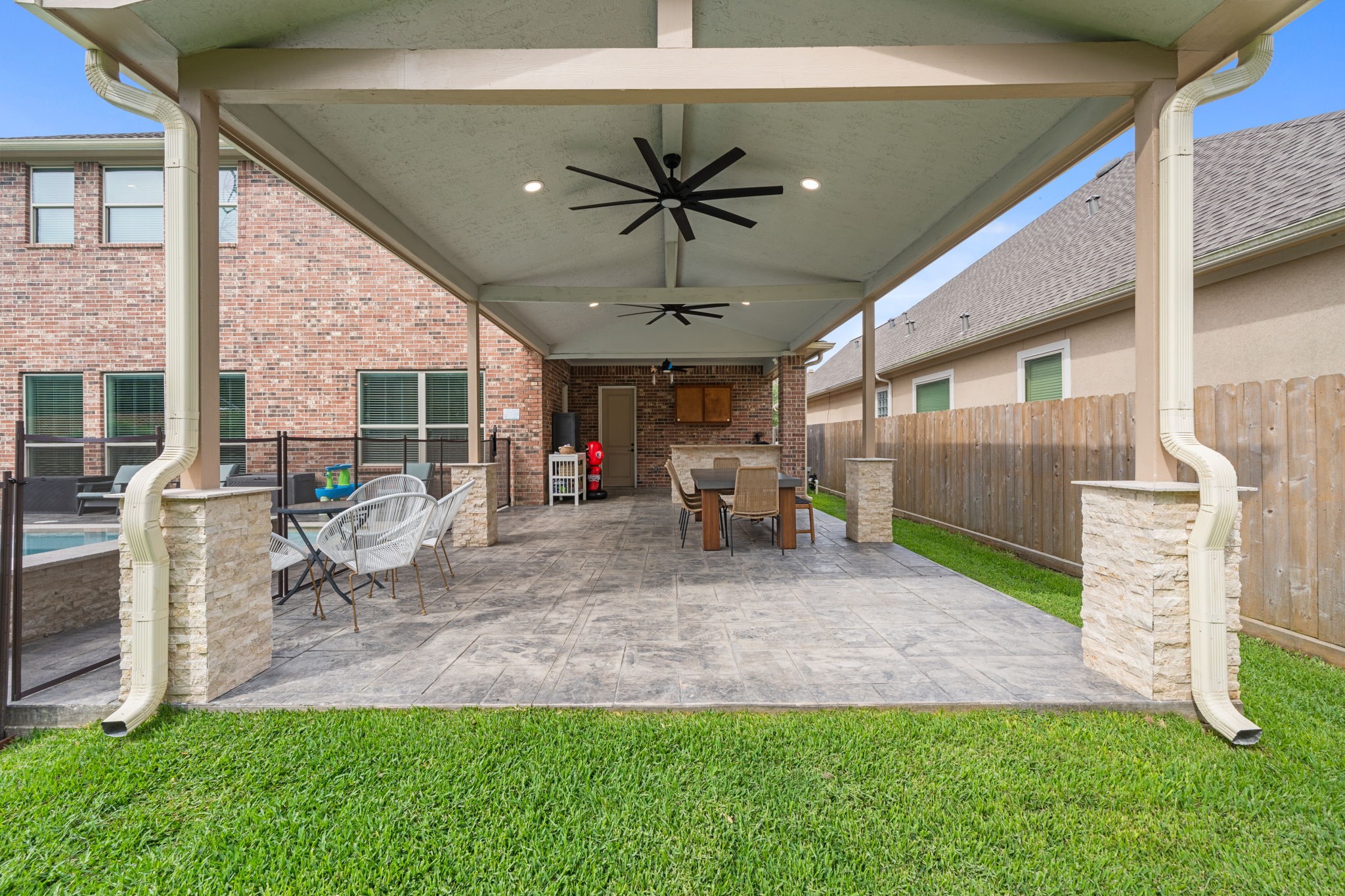 Covered outdoor living space with outdoor kitchen designed for year-round enjoyment Covered outdoor living space with outdoor kitchen designed for year-round enjoyment