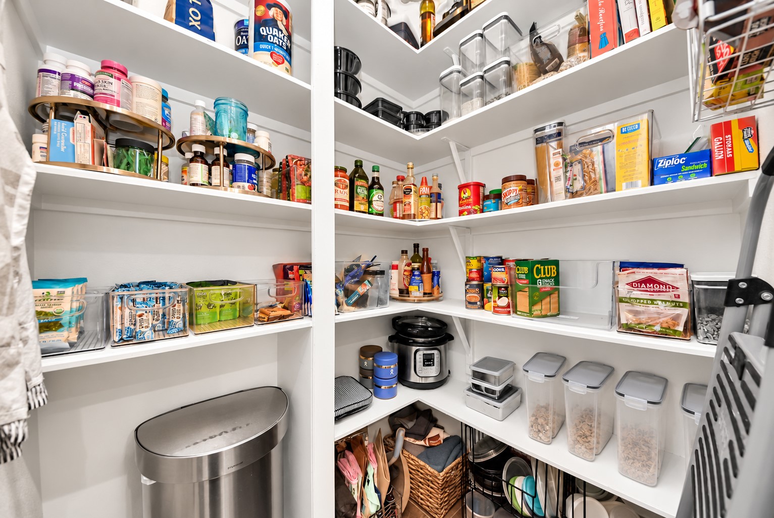 Another view of the generously sized pantry highlighting its excellent organization, multiple shelving levels, and convenient storage solutions. Another view of the generously sized pantry highlighting its excellent organization, multiple shelving levels, and convenient storage solutions.