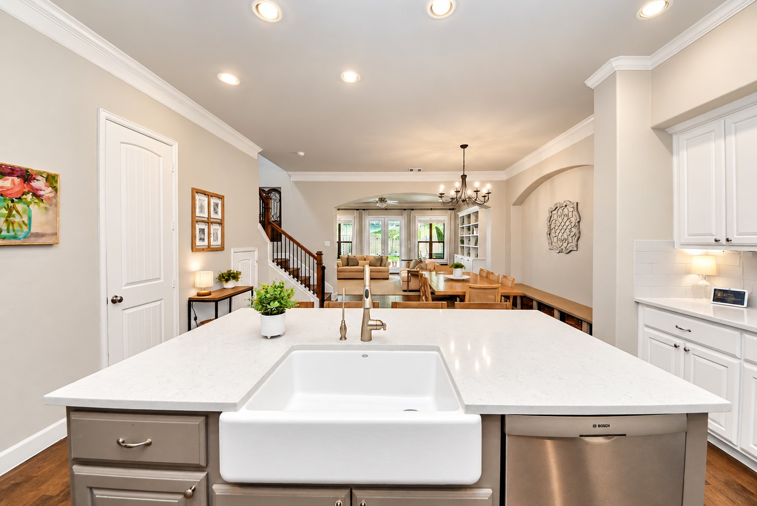 Beautiful view from the kitchen island showcasing the open-concept layout, spacious dining area, and inviting living room. Beautiful view from the kitchen island showcasing the open-concept layout, spacious dining area, and inviting living room.