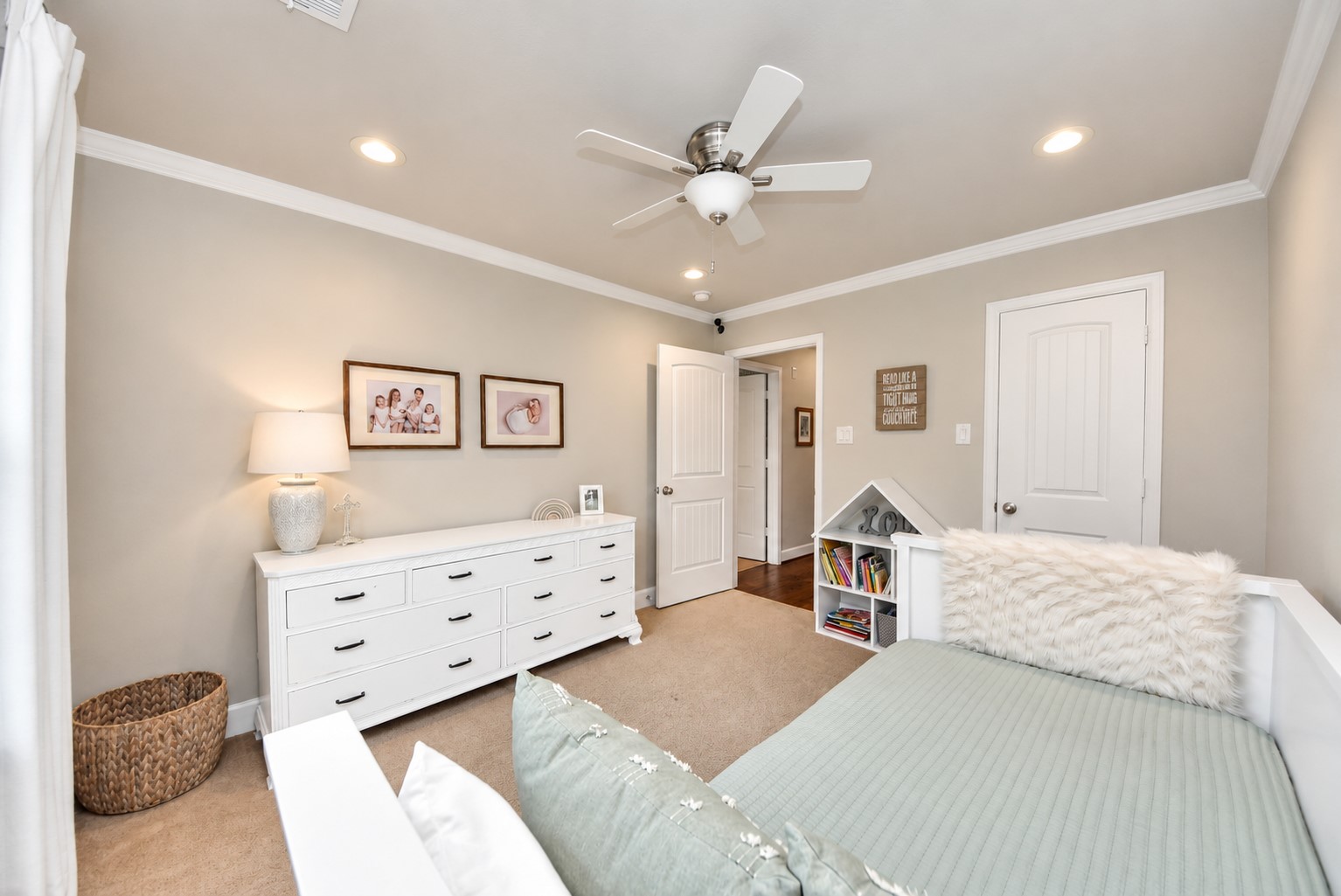 Additional view showcasing the bedroom's spacious layout, neutral finishes, and ample room for furniture and storage.