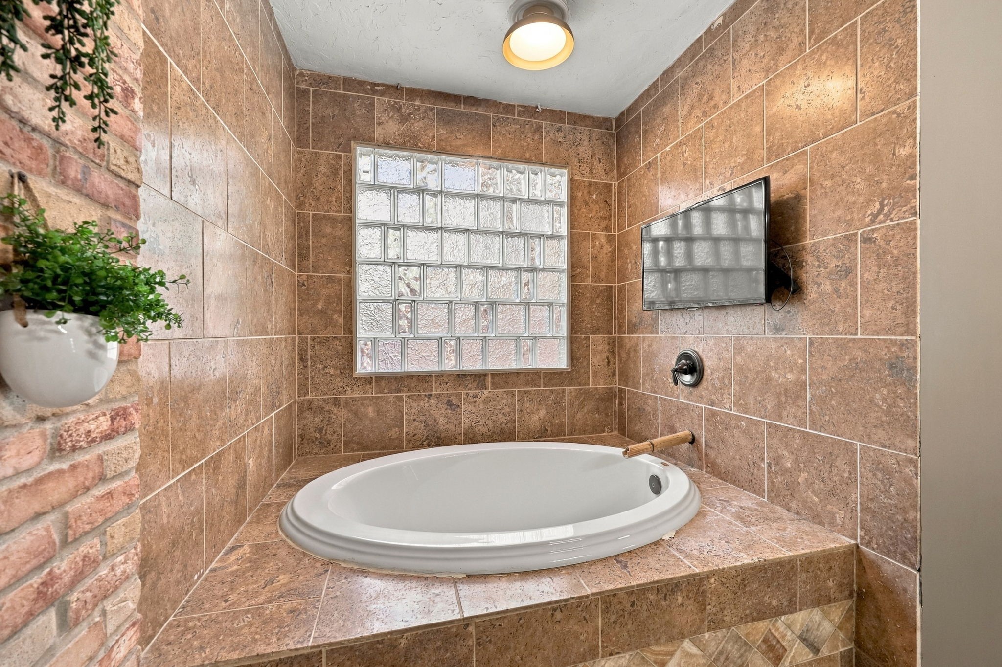 Primary Bath at back of house with soaking tub