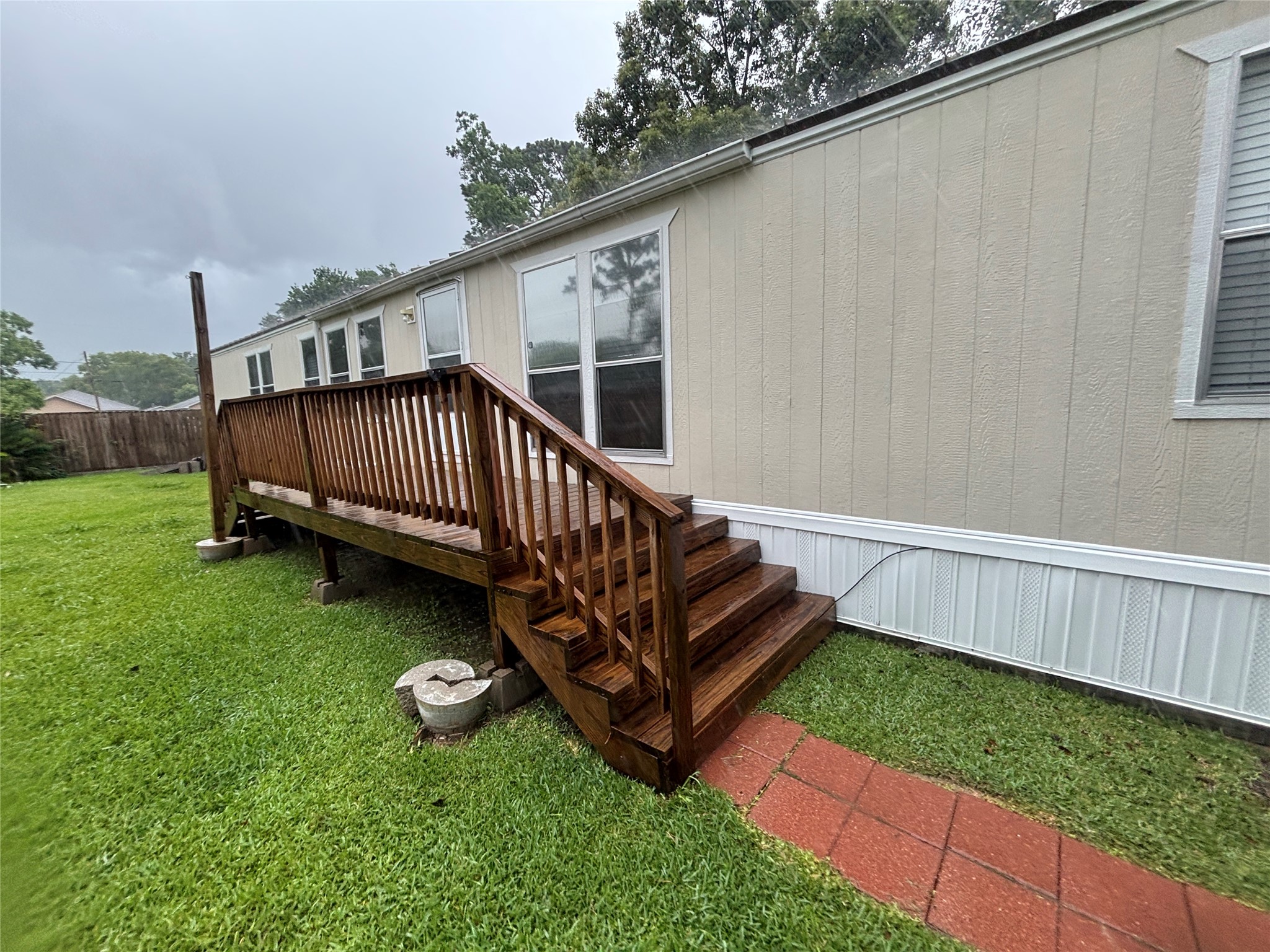 The deck area is great for sitting outside and enjoying the view of the over-sized yard.