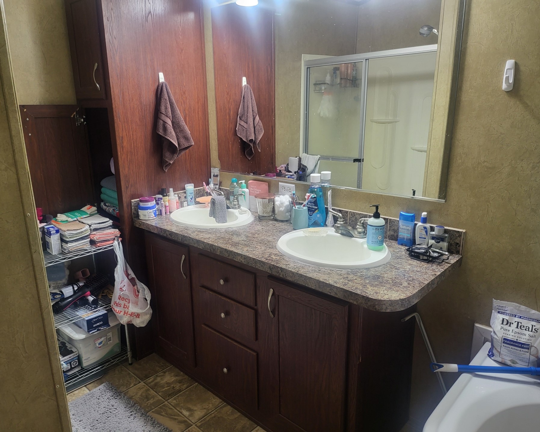 The primary bath has double sinks, a full-size walk-in shower and comfortable soaker tub.