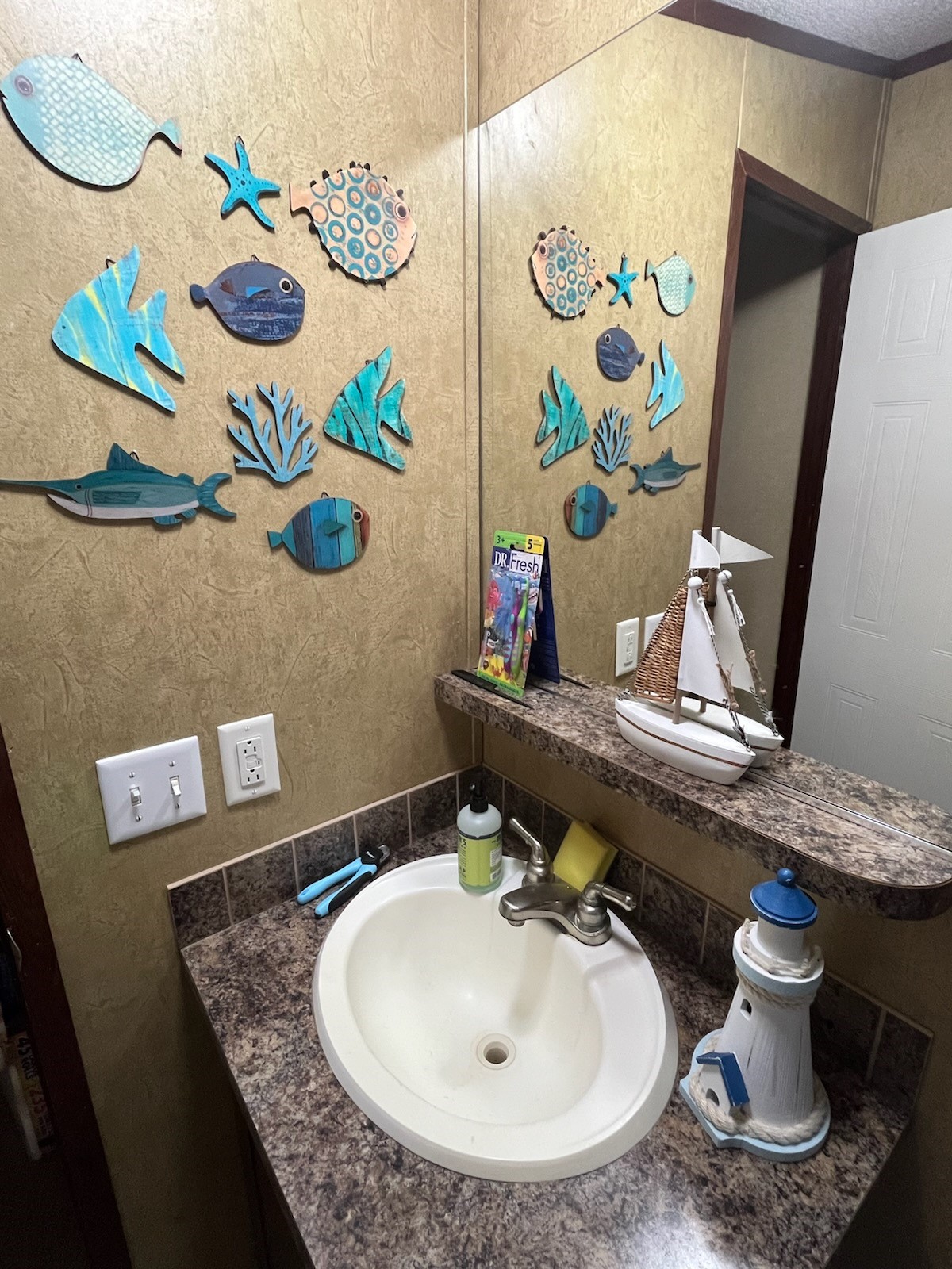 Secondary bath vanity and sink area have a built-in shelf for additional storage.