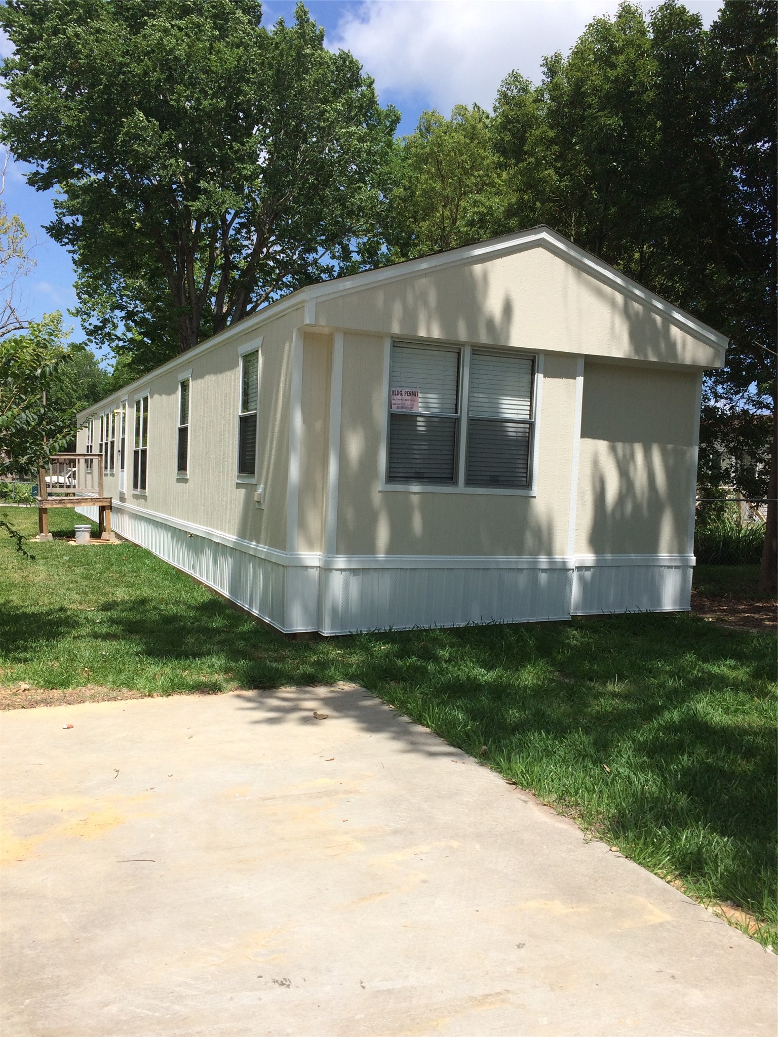 The surrounding trees and large yard are a bonus.