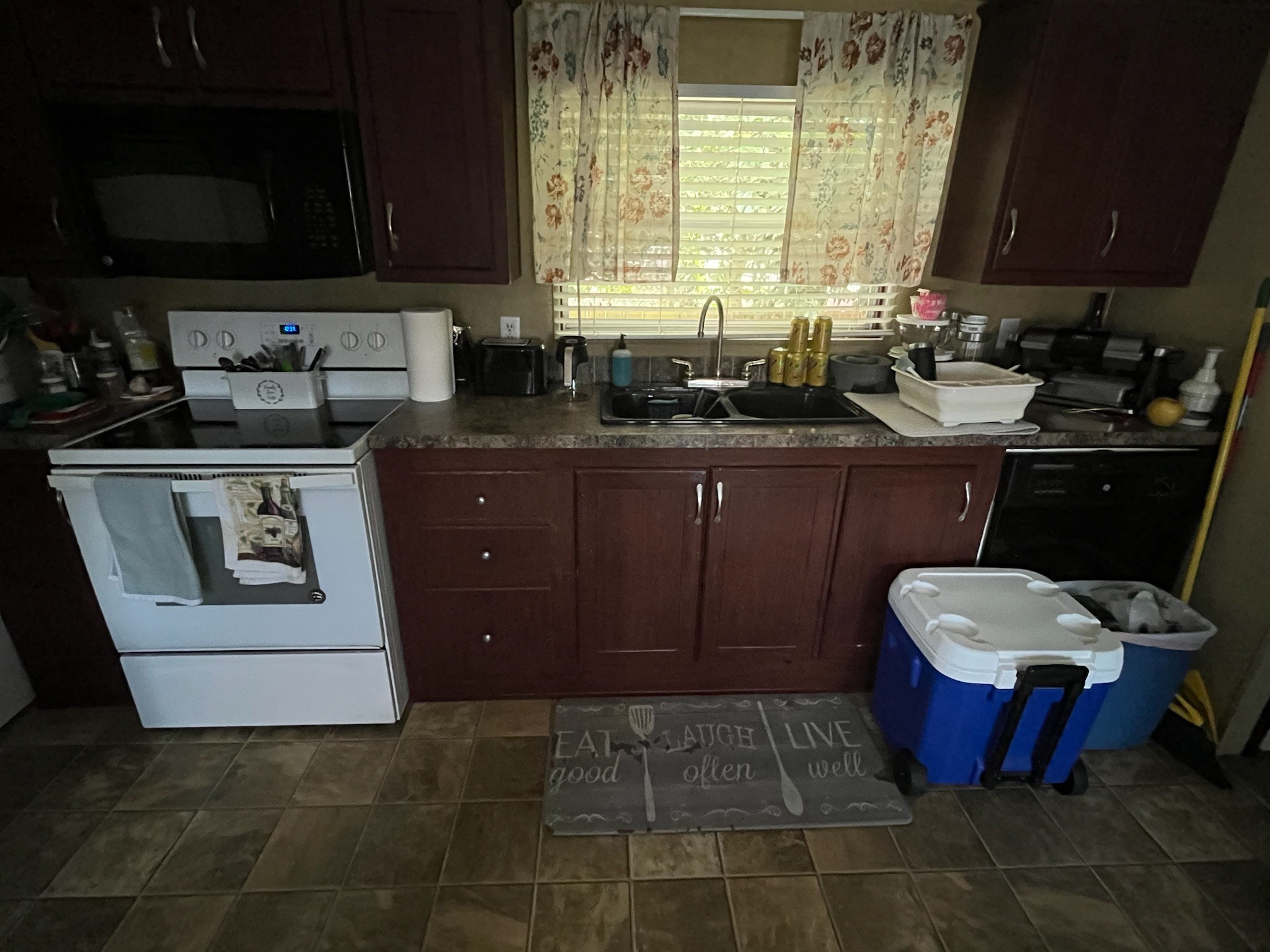 The kitchen is conveniently located to both the family room and the formal dining area.
