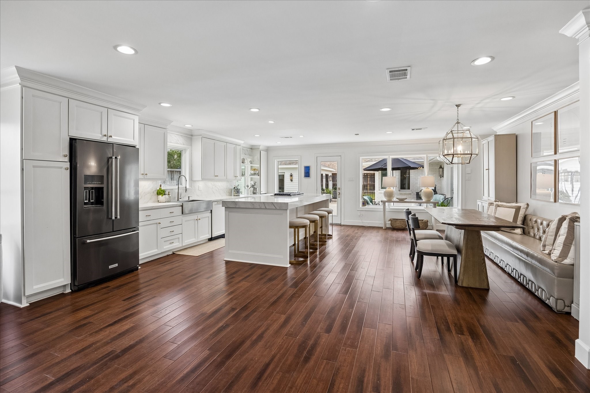 Beautiful and thoughtfully designed kitchen and breakfast nook with designer lighting. Beautiful and thoughtfully designed kitchen and breakfast nook with designer lighting.