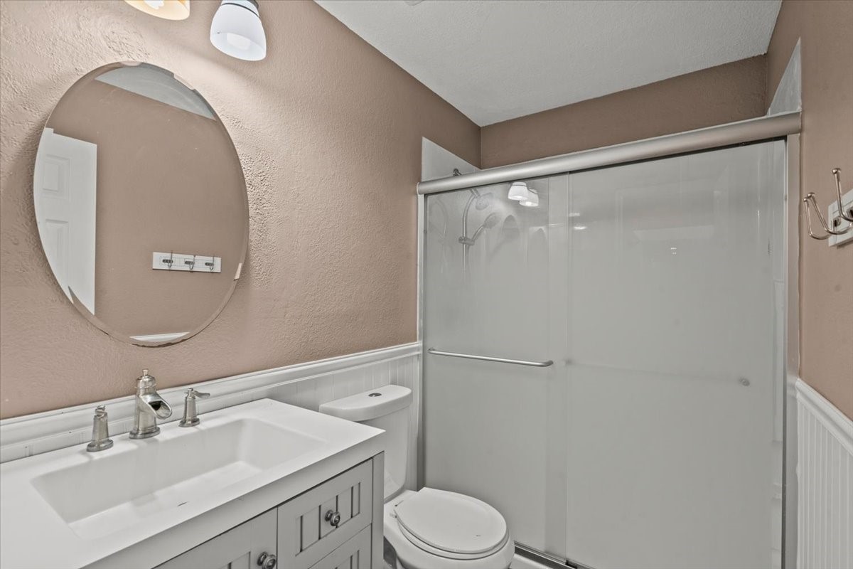 Secondary bathroom has updated shower.