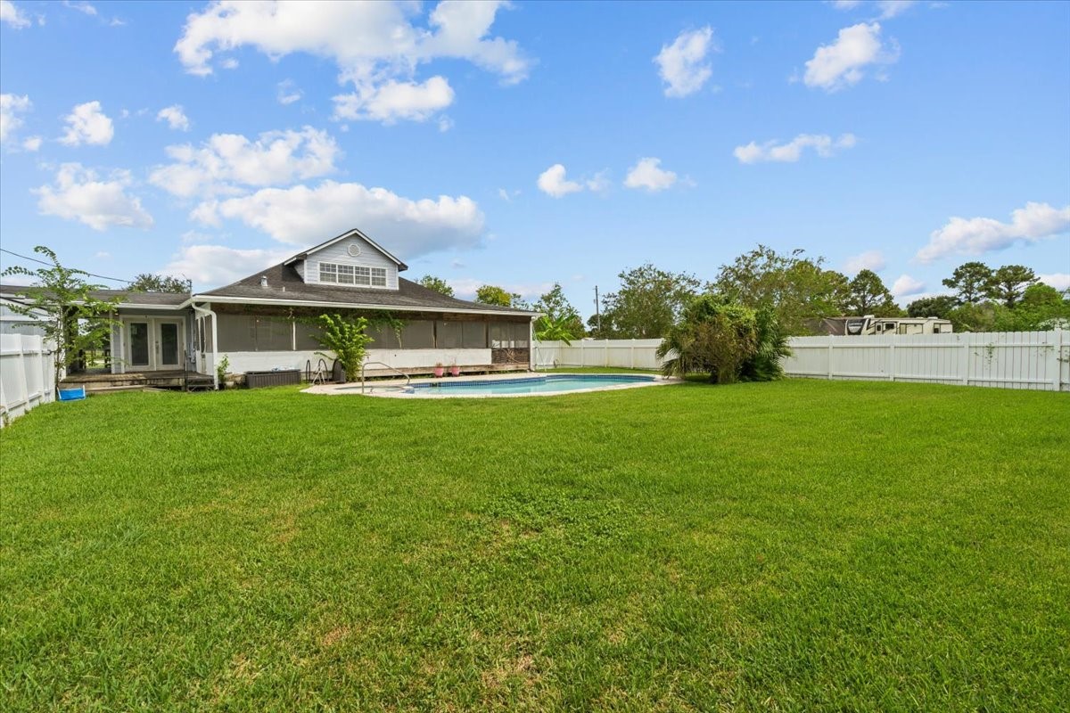 Back yard has lots of room for entertaining. Diving board on pool has been removed for insurance purposes. Pool has a deep end. Back yard has lots of room for entertaining. Diving board on pool has been removed for insurance purposes. Pool has a deep end.