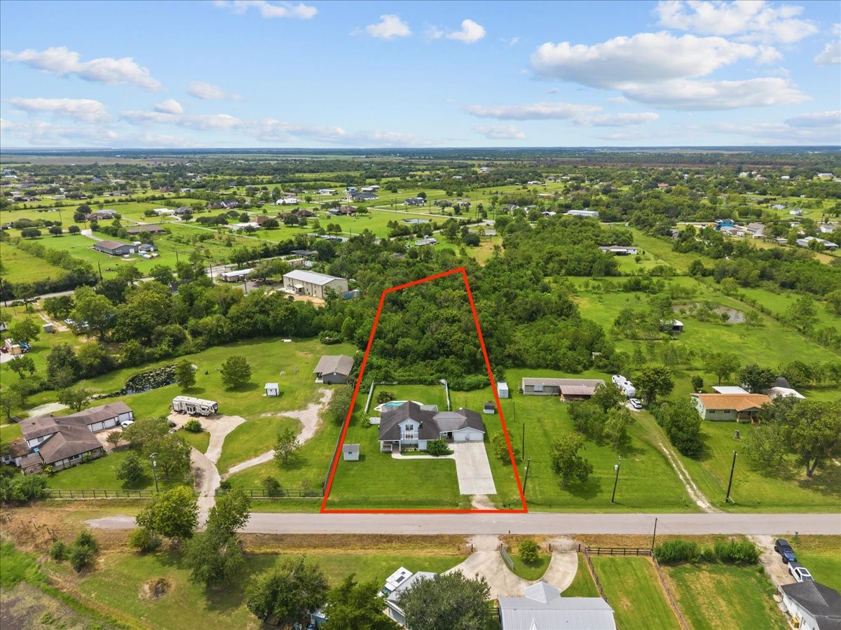 1.7 acres extends beyond the white fenced back yard area. 1.7 acres extends beyond the white fenced back yard area.