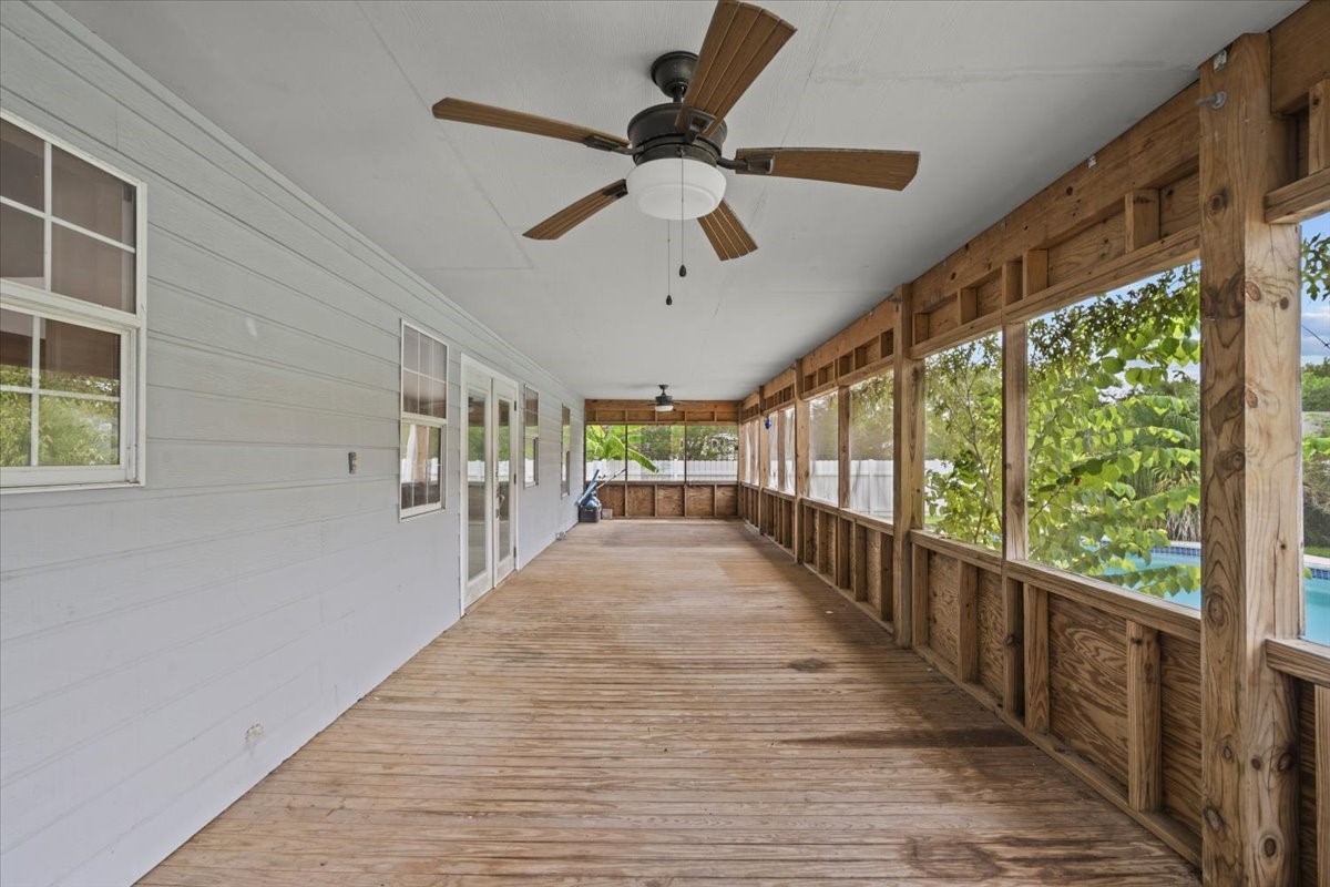 Screened in porch runs the length of the house.