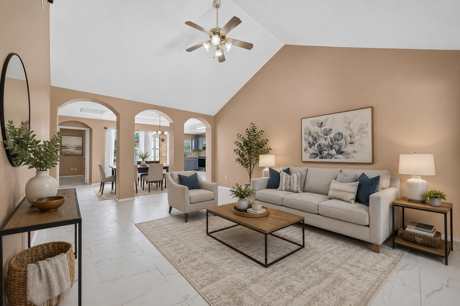 Spacious family room with soaring vaulted ceilings, abundant natural light, and an open-concept layout that flows seamlessly into the dining area and updated kitchenperfect for everyday living and entertaining.