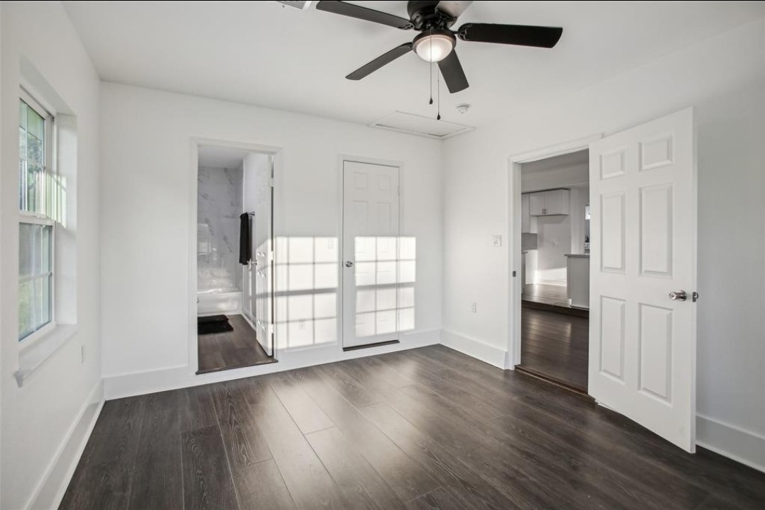 View of primary bedroom with natural light