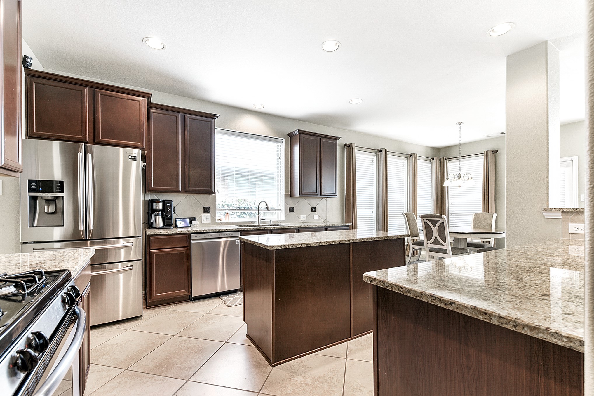 The kitchen offers a three-way entrance, providing easy access to both the breakfast room and dining room, facilitating seamless flow and convenience for entertaining and everyday living.