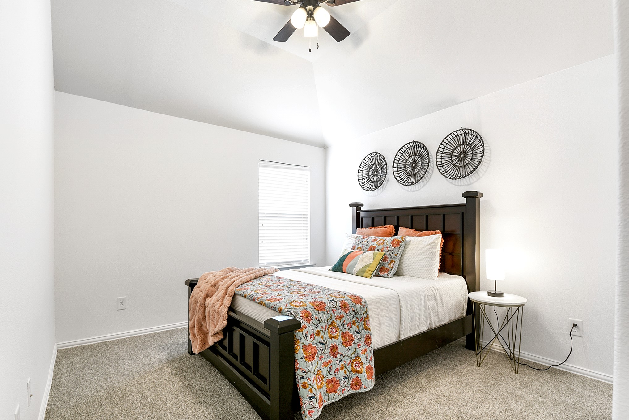 Another upstairs bedroom comes complete with a ceiling fan, providing comfort and airflow, while maintaining the rooms cozy atmosphere.