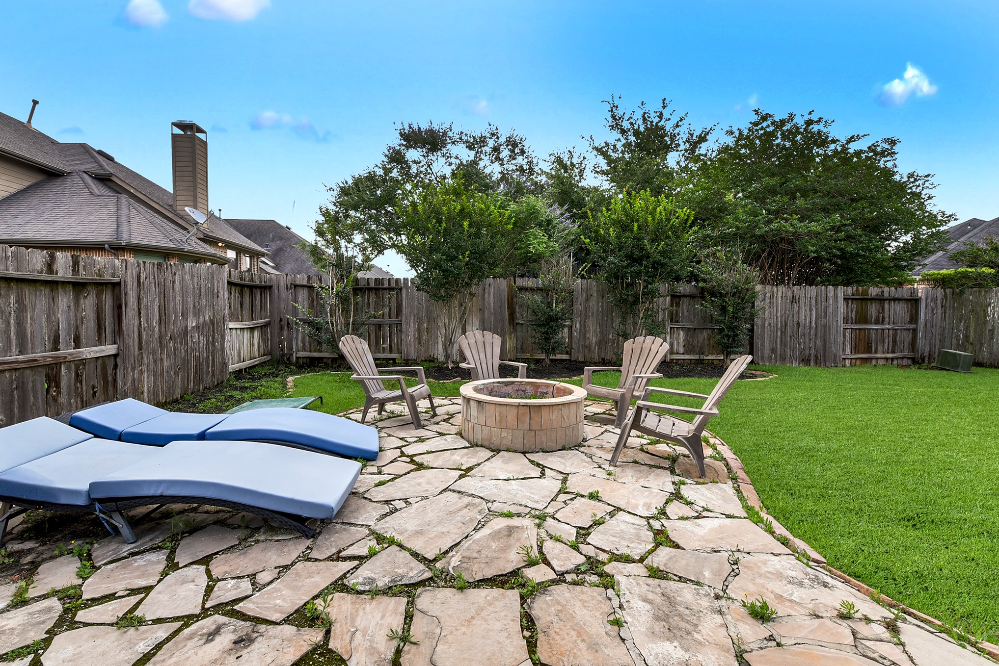 The expansive backyard offers abundant space for outdoor activities, sports, and play, providing endless opportunities for enjoyment and relaxation.