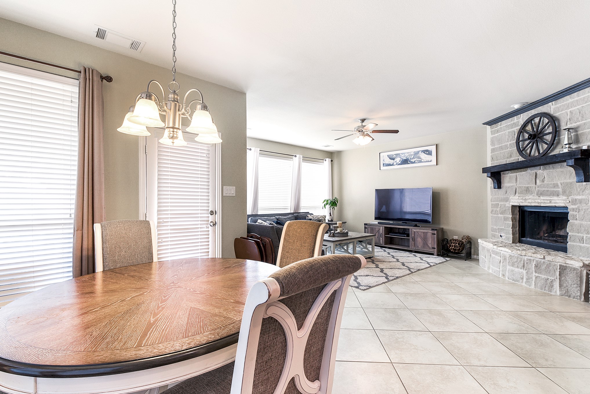 The breakfast room is spacious and offers views into the backyard, creating a bright and inviting space for dining. The back door, easily accessible from the kitchen, provides seamless access to outdoor entertaining and dining areas, enhancing the overall flow and functionality of the home.