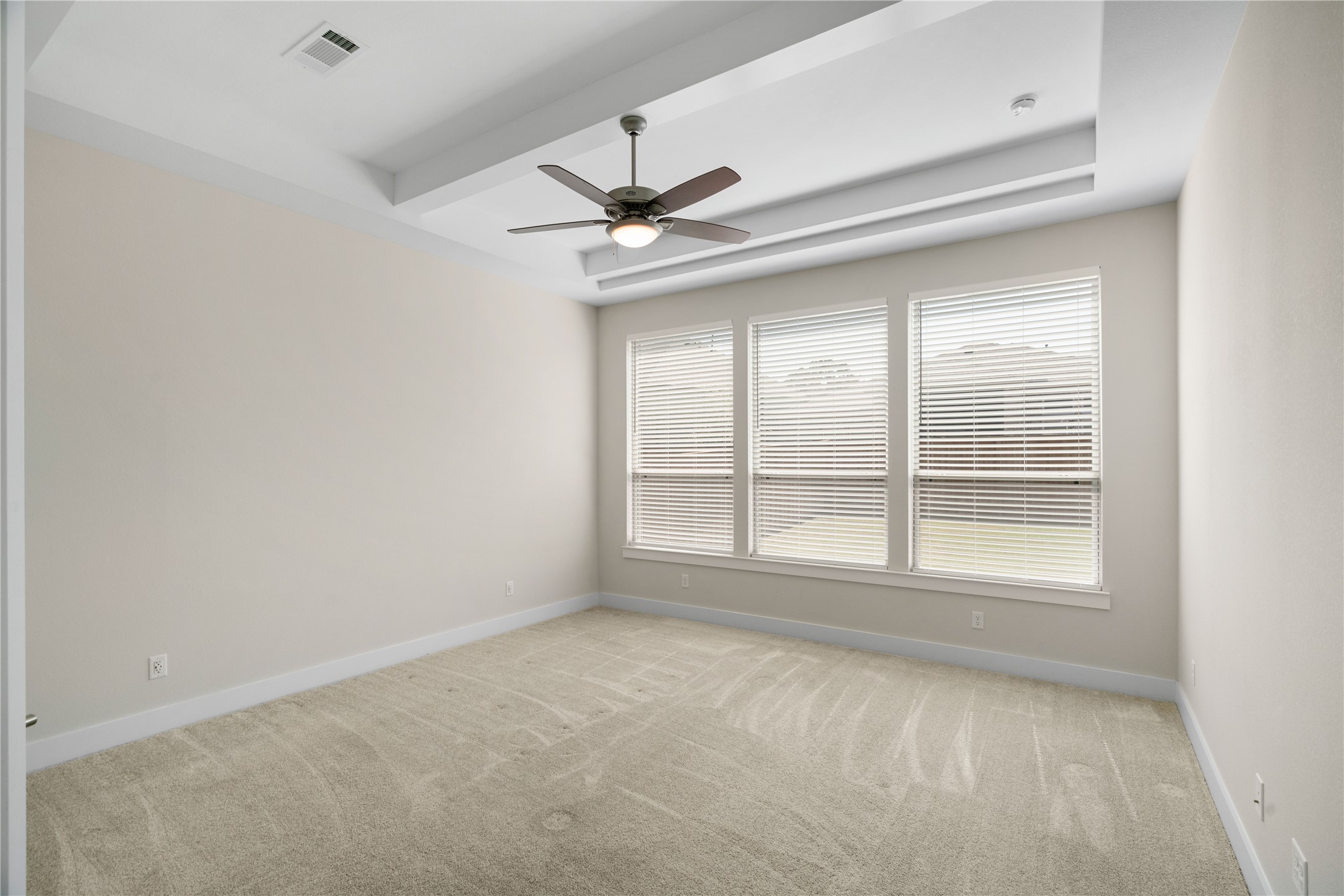 Primary spacious bedroom with ensuite bathroom.