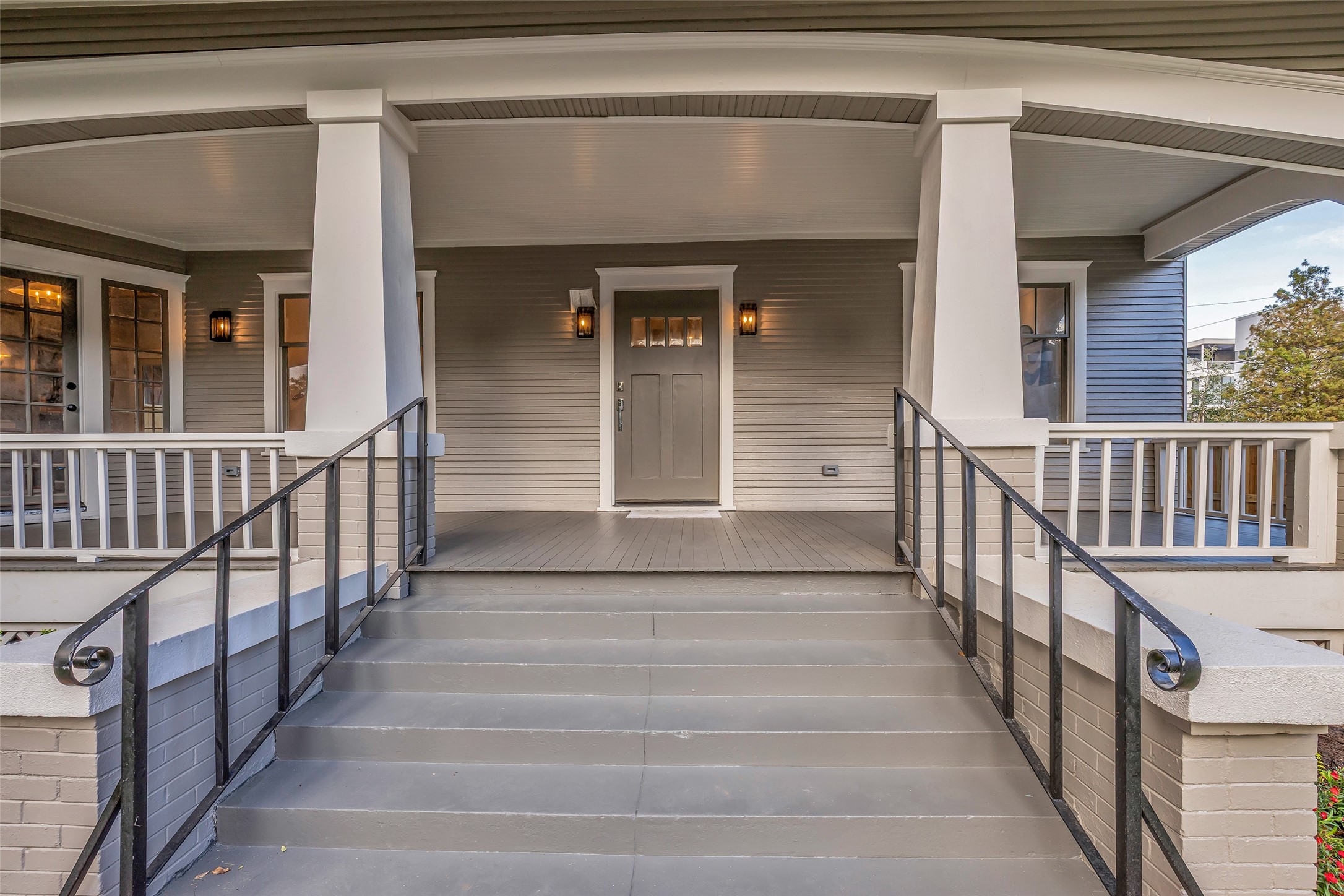 Spacious front porch with arched details and craftsman style columns. Spacious front porch with arched details and craftsman style columns.