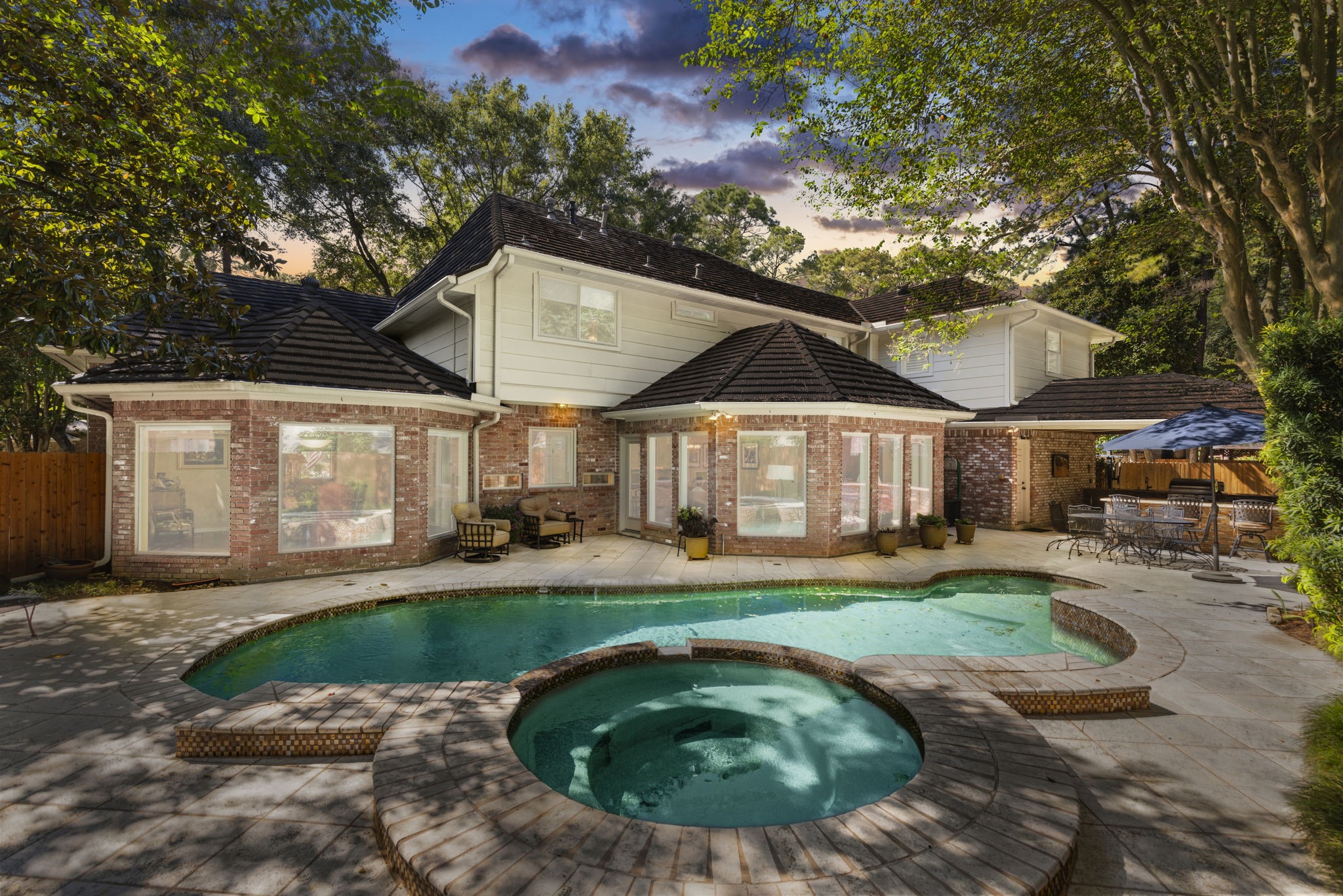 From the spa to the covered outdoor kitchen, this backyard brings swimming, dining, and relaxation together, with an automatic mosquito repellent system adding convenience.