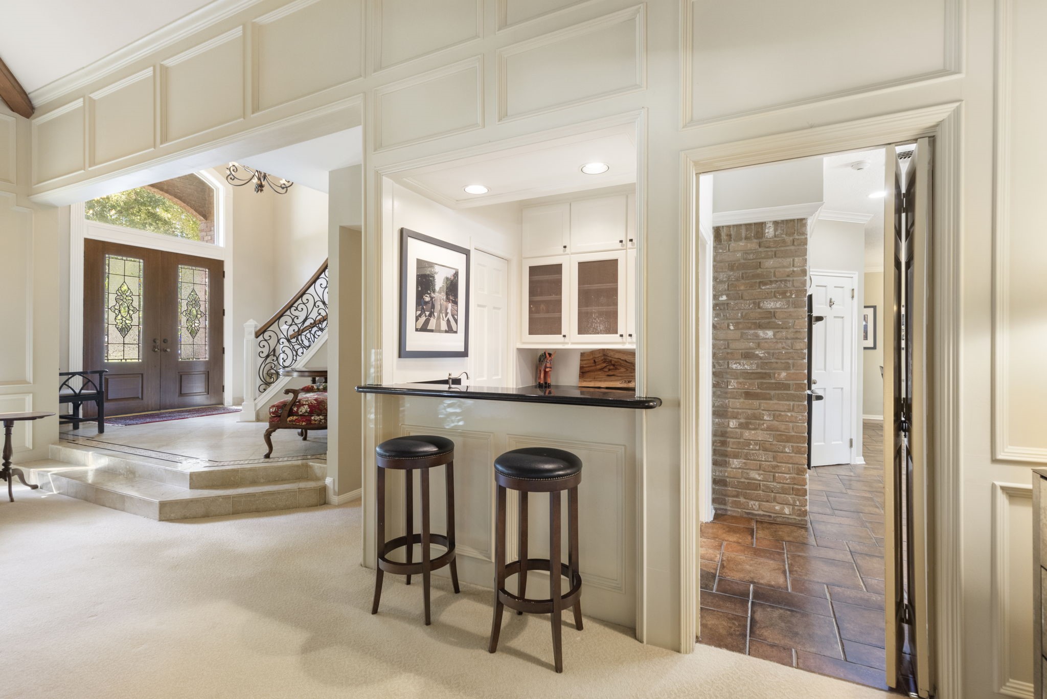 A built in serving bar beside the living room keeps refreshments close at hand when entertaining.