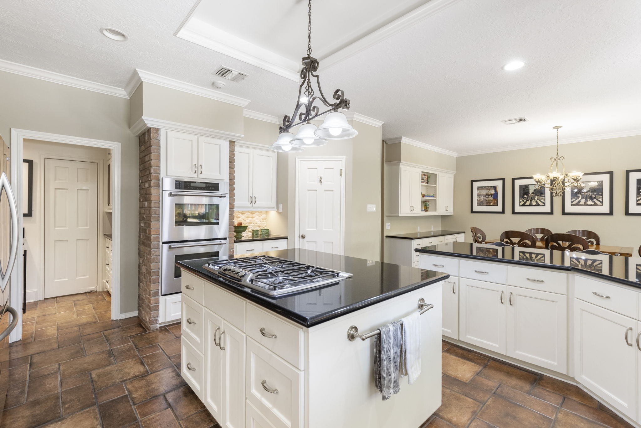 Extensive cabinetry and multiple work surfaces provide room to prepare, serve, and stay organized with ease.