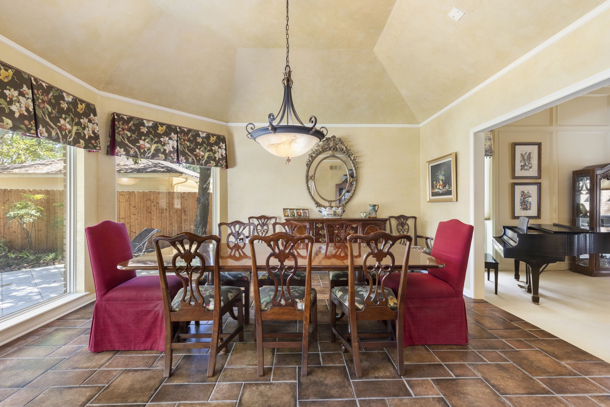 Wrapped in backyard views, the intimate dining room offers a lovely setting for quiet dinners and special celebrations.