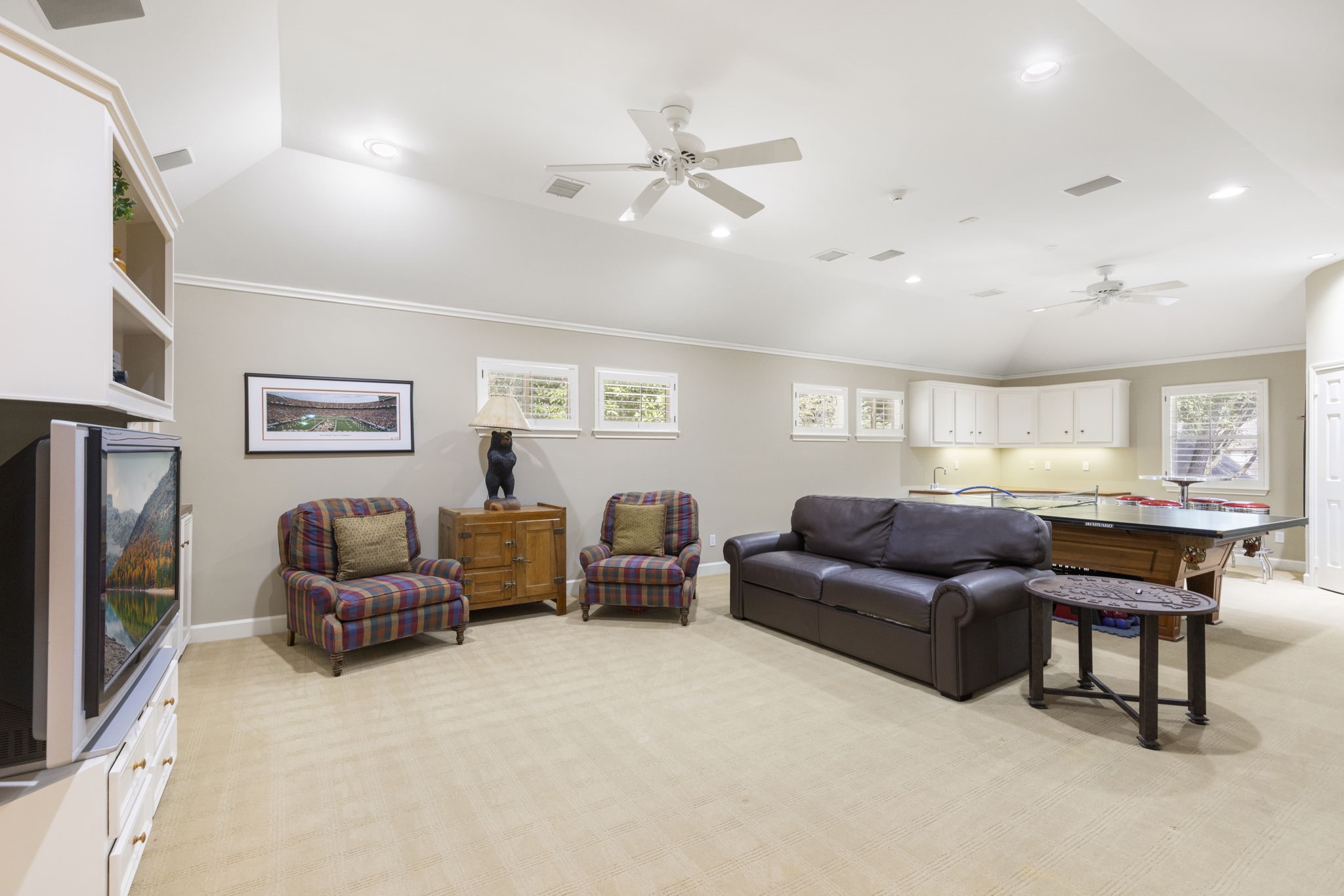 Added above the garage, the expansive game room creates a versatile destination for recreation, movie nights, and larger gatherings.