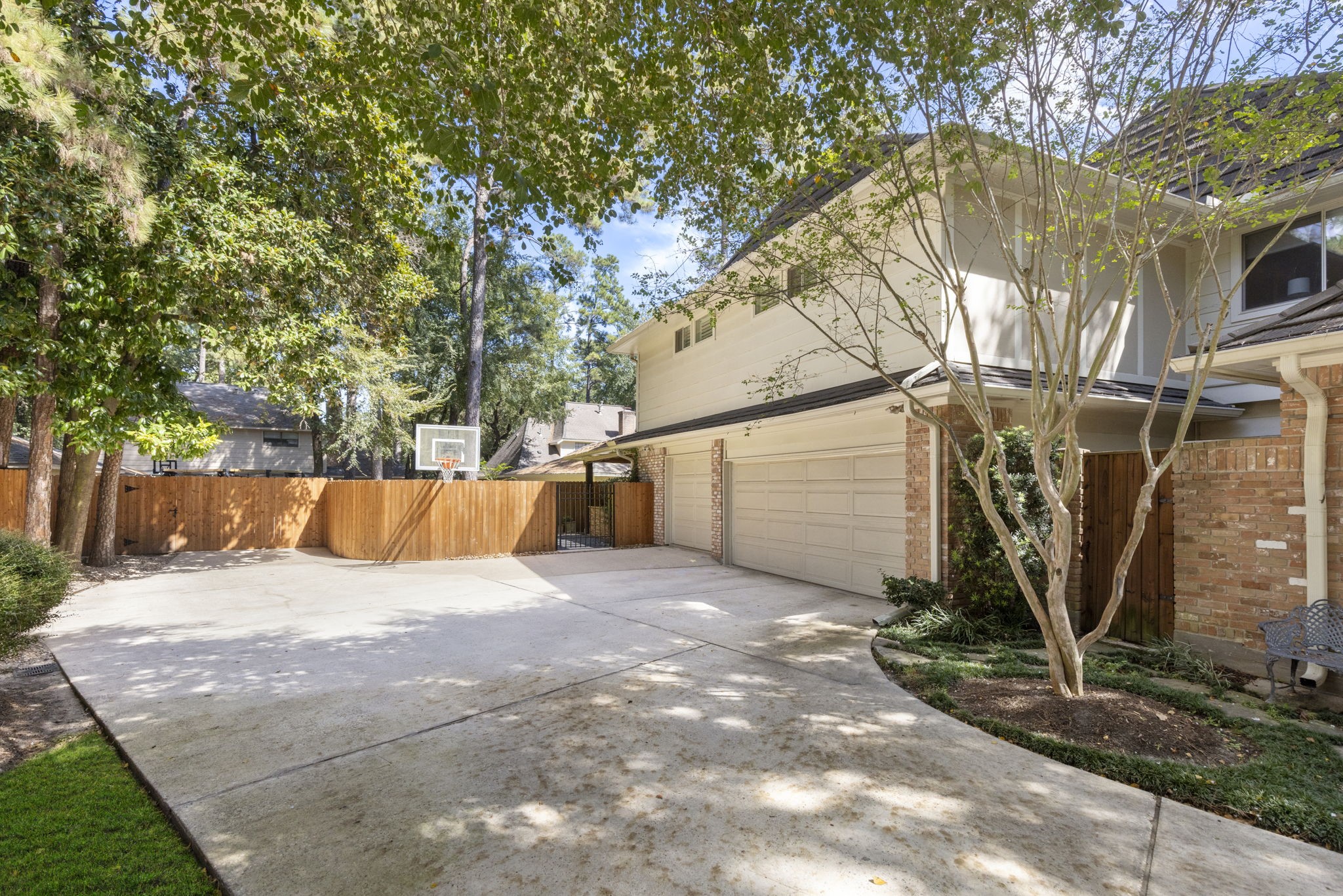 An expansive driveway offers generous parking and room for outdoor recreation beside the 3 car garage.