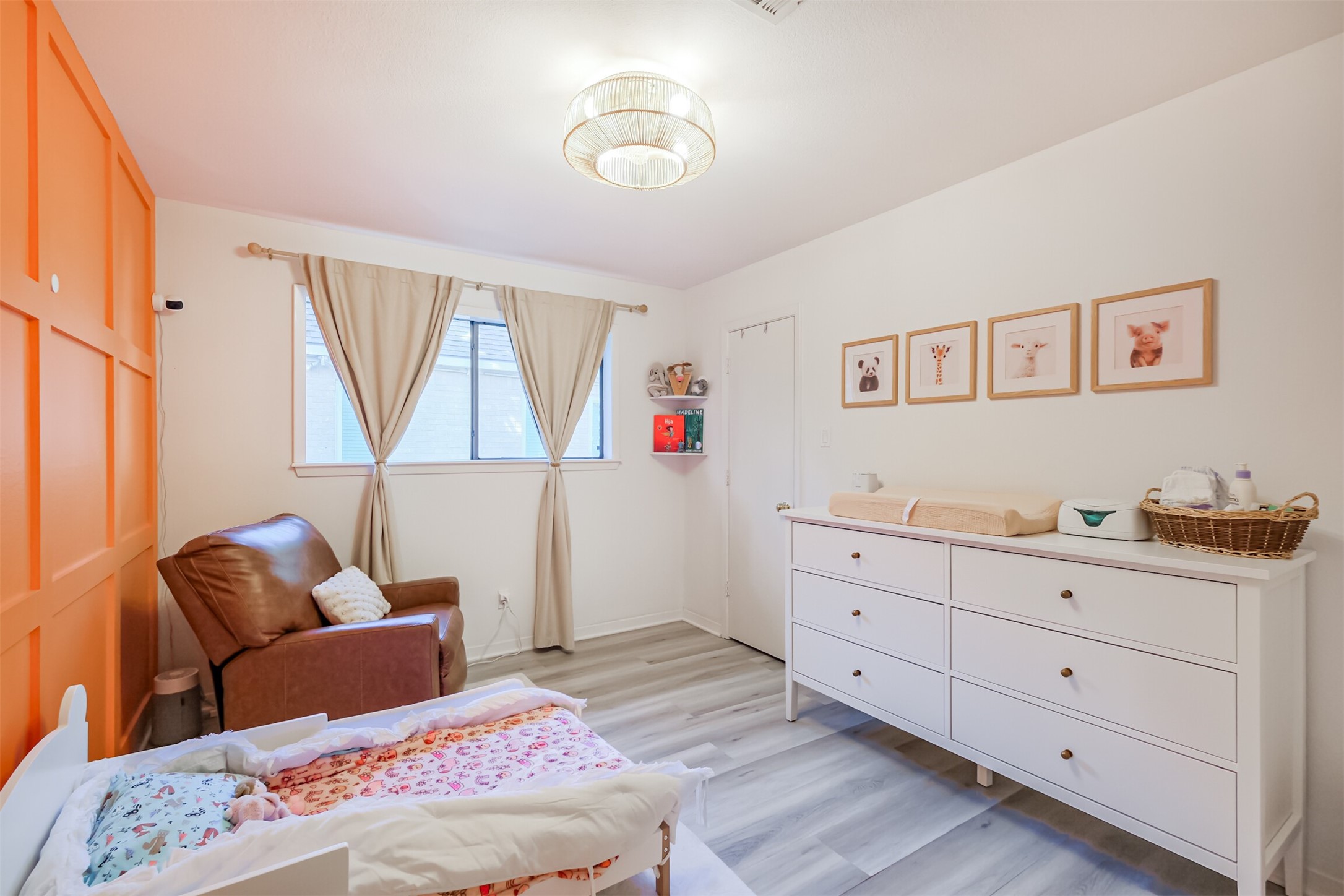 The second bedroom has wainscotting, updated light fixture and a nice size walk in closet.